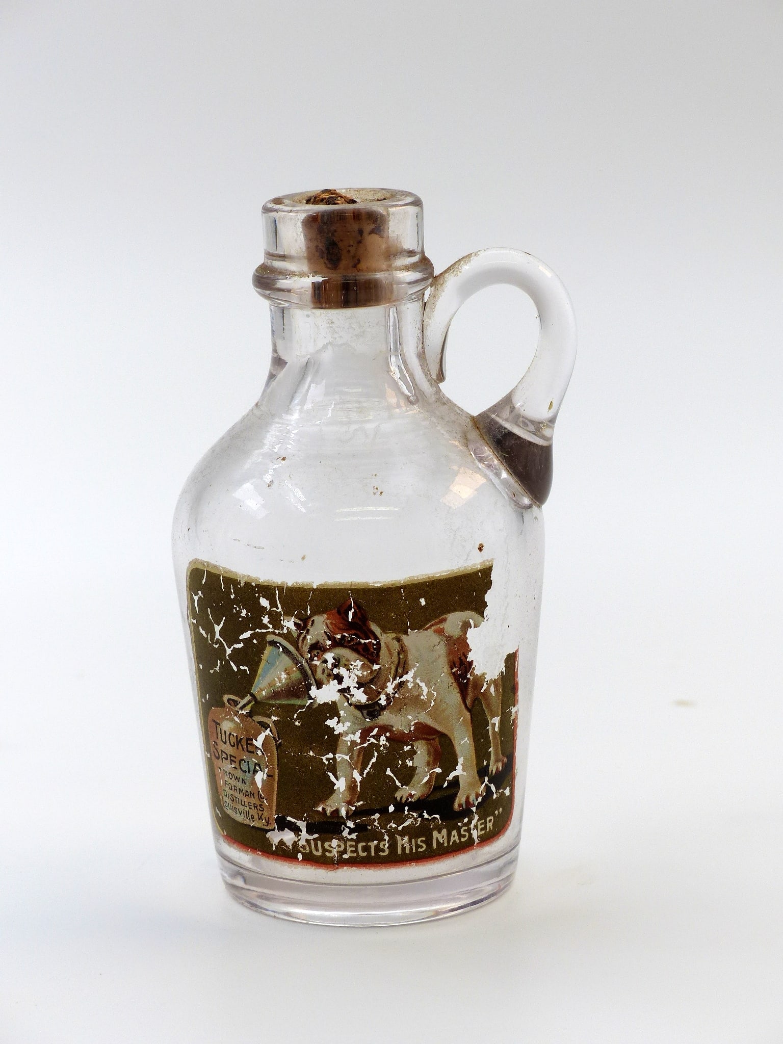 Clear Tucker Special Sample Bottle: Clear Tucker Special Sample Bottle -Clear; Dog on Label ; Condition: Mint ; 4"H