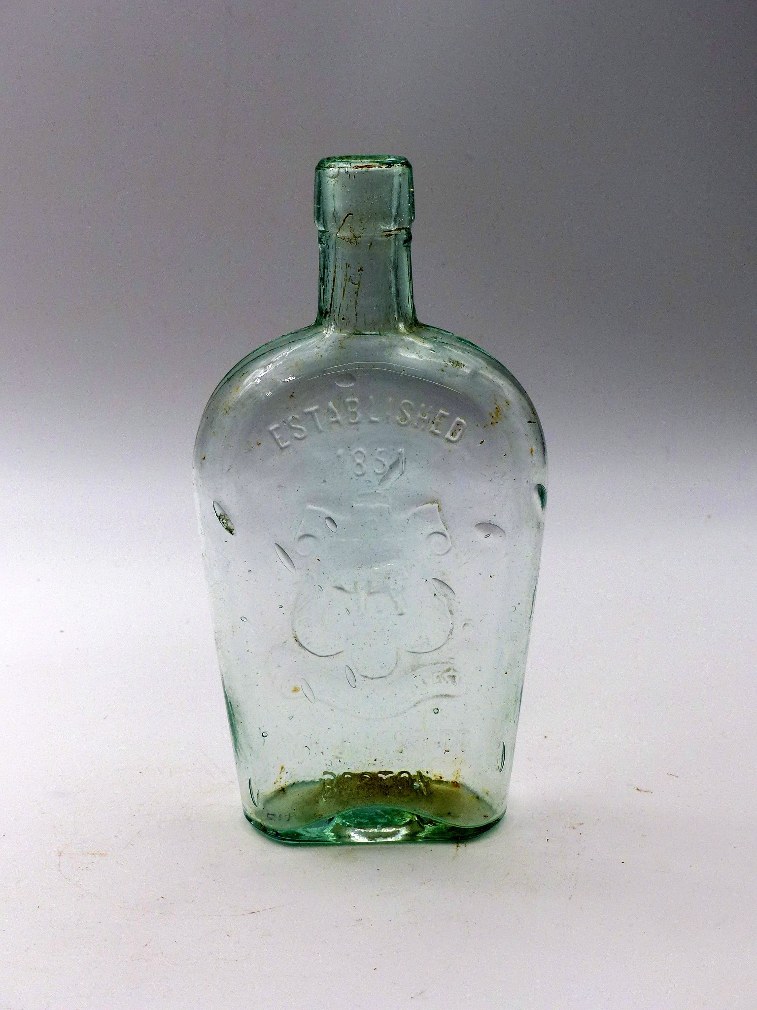 W.H. Jones & Co. Tombstone Bear Flask - Established 1851: W.H. Jones & Co. Tombstone Bear Flask - Established 1851 -Boston, Mass.; Embossed bear trademark ; Ca. 1880 ; Condition: Mint ; 7.75"H