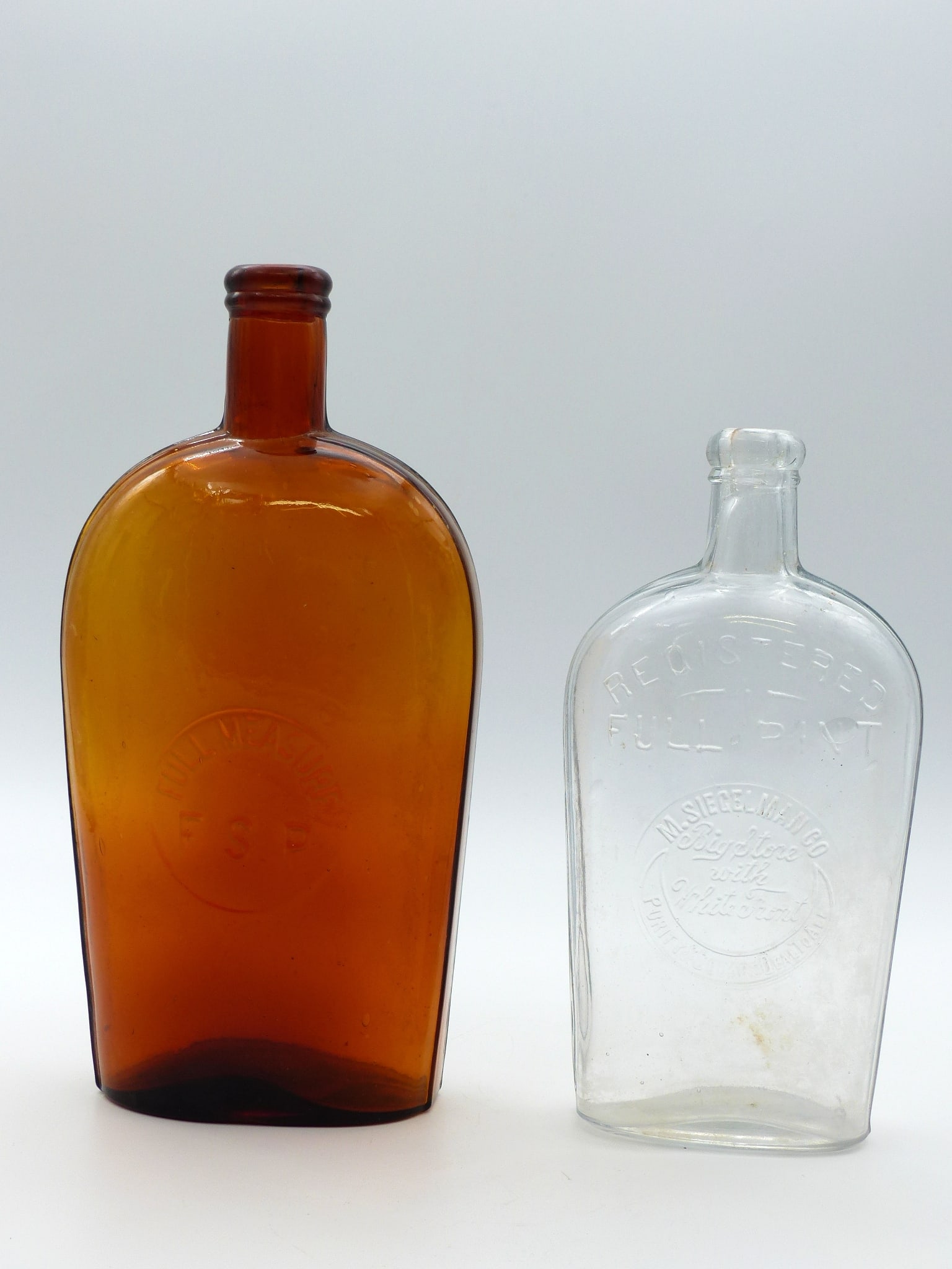 Group Of 2 Flask: Group of 2 Flask -Amber - Full Measure F.S.P. Bottle (Qt); M. Siegelman Co. "Big Store with White Front" (Pt) ; Condition: Mint ;