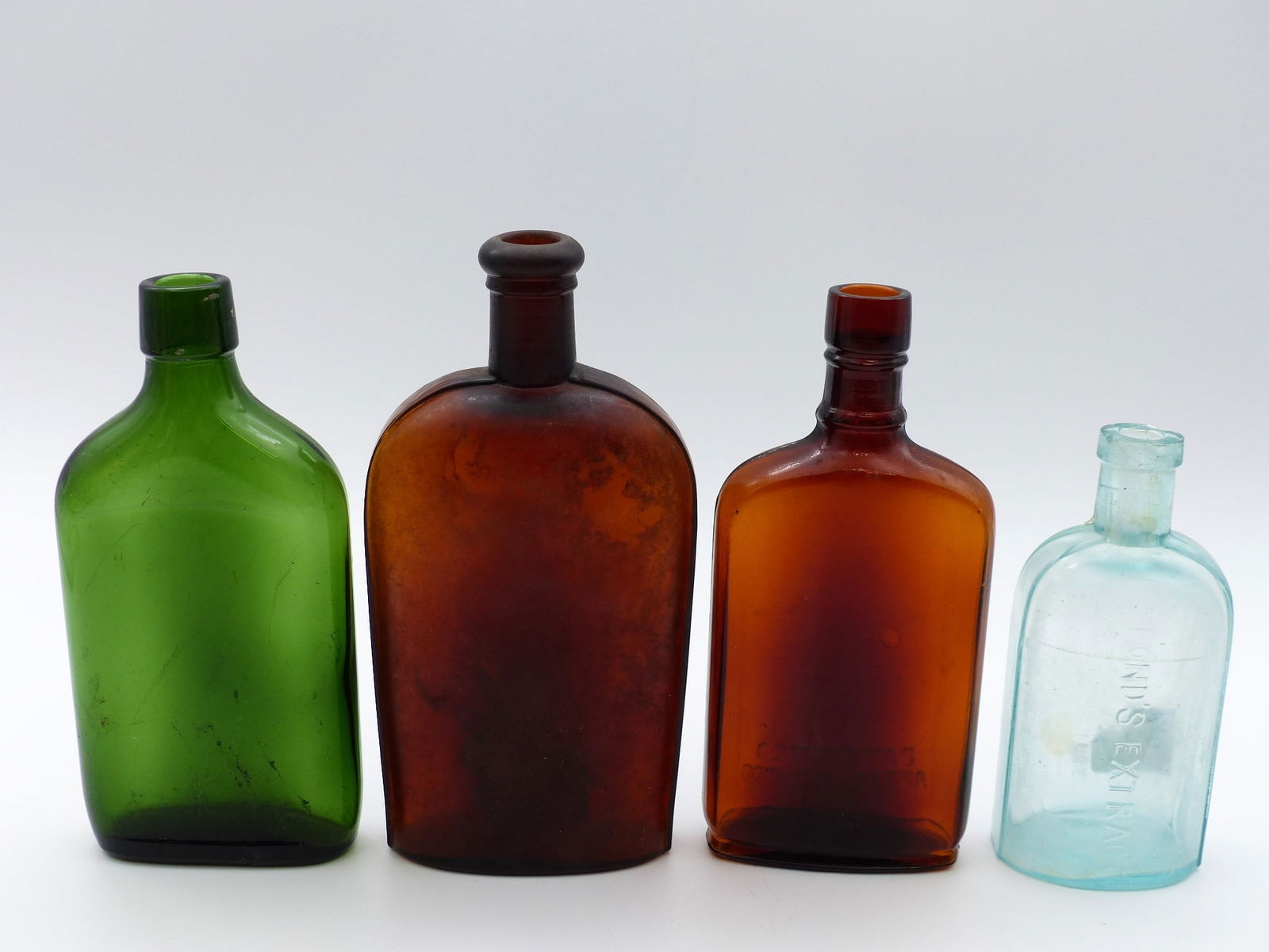 Group Of 4 Flask: Group of 4 Flask -2 Amber; 1 Aqua; 1 Green ; Condition: Good ;