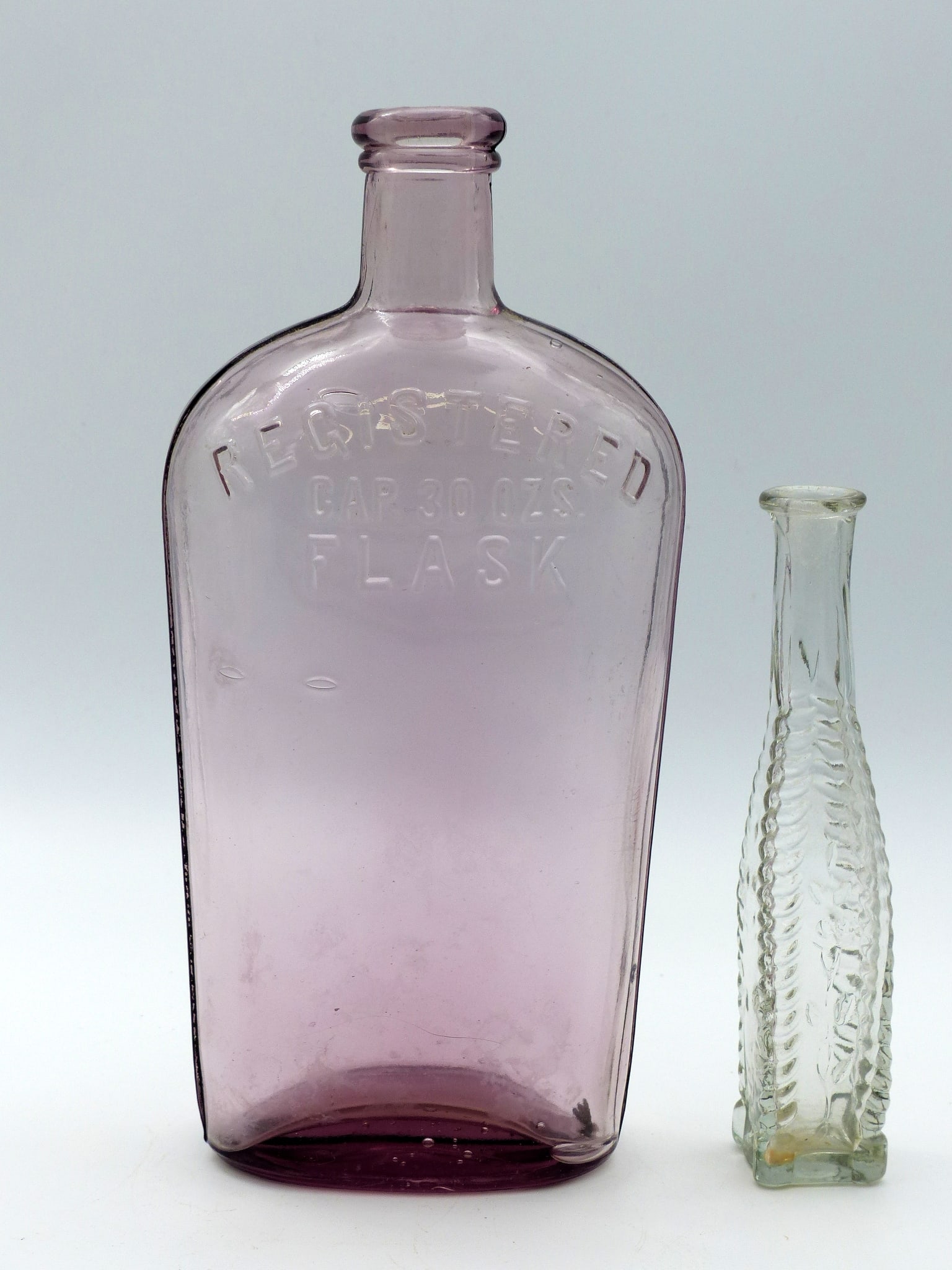 Group Of 2 Antique Bottles: Group of 2 Antique Bottles -Registered GAP 30 ozs. Flask (9 1/2") Excellent condition; Small Unusual Cathedral Bottle (6 1/8") Mint condition