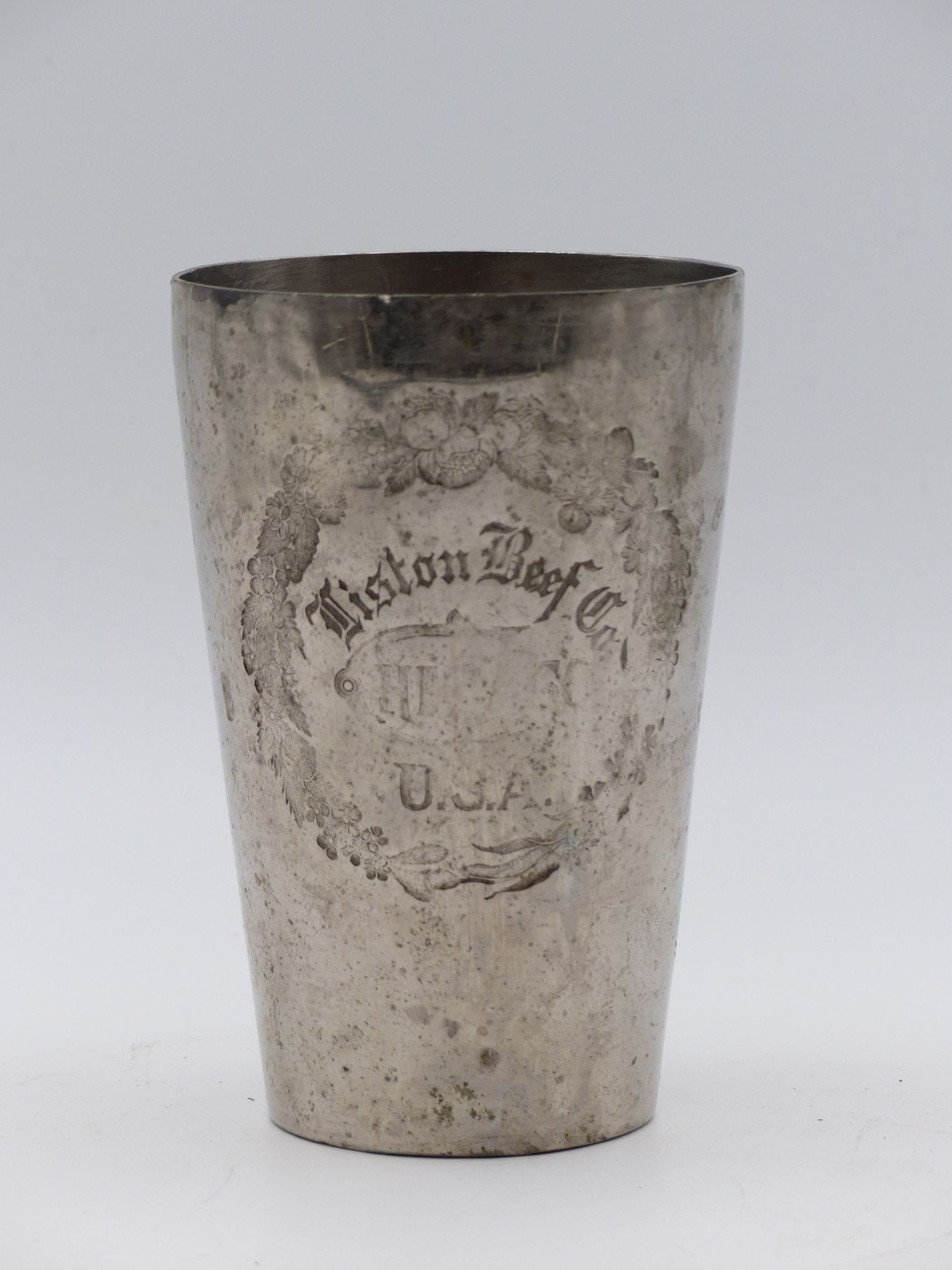 "Winston Beef Company Engraved Silver Cup: This vintage Winston Beef Company engraved silver cup showcases exquisite craftsmanship and historical significance. The cup features an intricate floral engraving surrounding the company name, 'Winst