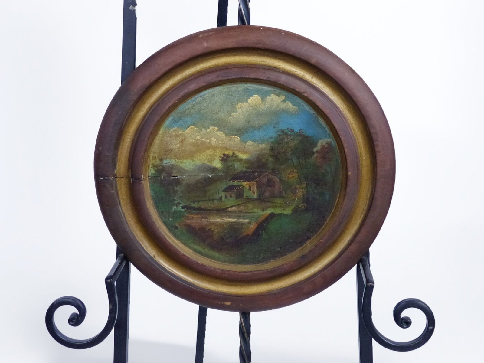 Hand-Painted Log Cabin on Wood (Fair Condition): This hand-painted log cabin artwork captures a serene rural landscape, beautifully rendered on a wooden surface. The painting showcases a delicate interpretation of a log cabin situated near a tranqui