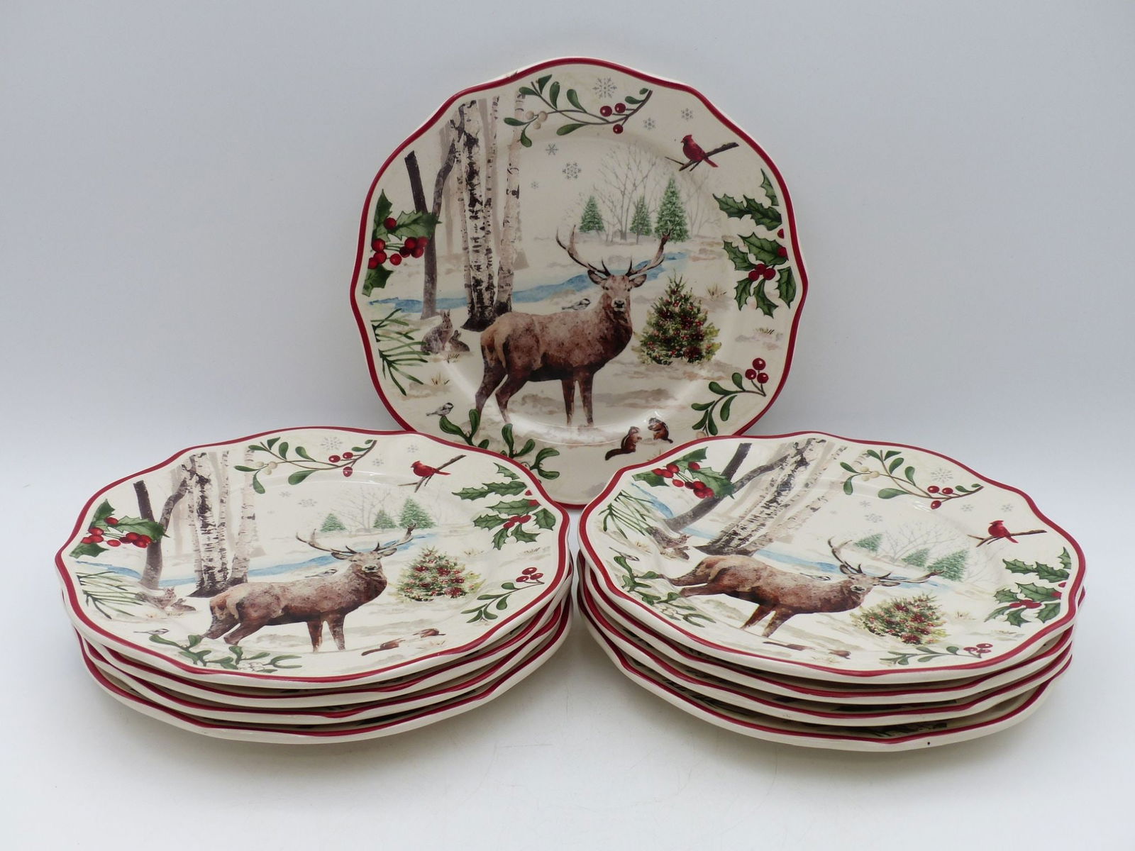 Christmas Deer Plate Collection (Nine Pieces): This exquisite collection features nine intricately designed Christmas deer plates, perfect for holiday celebrations and table settings. Each plate displays a charming winter scene, showcasing majesti