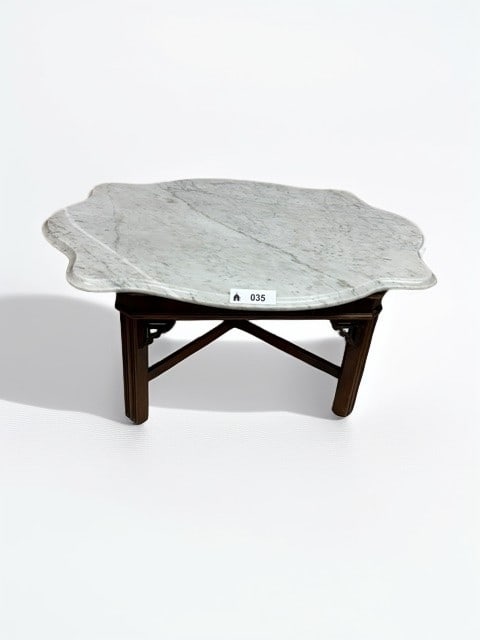 Chinese Hardwood Stand with Inset Marble Top: This exquisite hardwood display stand features a lobed, serpentine-edged white marble top with natural grey veining, resting upon a traditional carved base. The wooden frame showcases delicate openwor