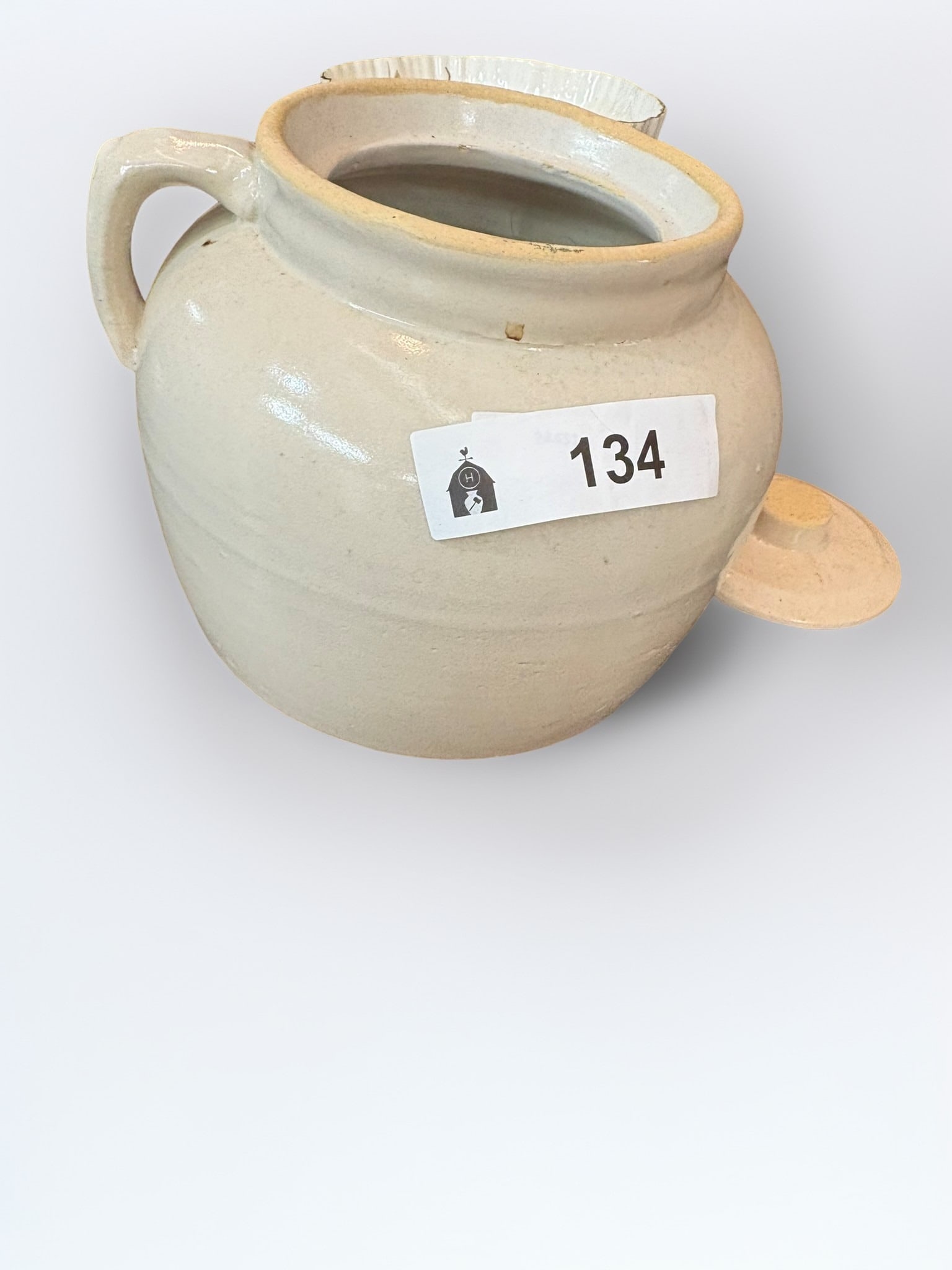 Antique American Stoneware Lidded Butter Crock: This classic American stoneware butter crock features a durable, light-colored slip glaze and a matching fitted lid. Designed with a sturdy side handle for easy transport, this functional piece