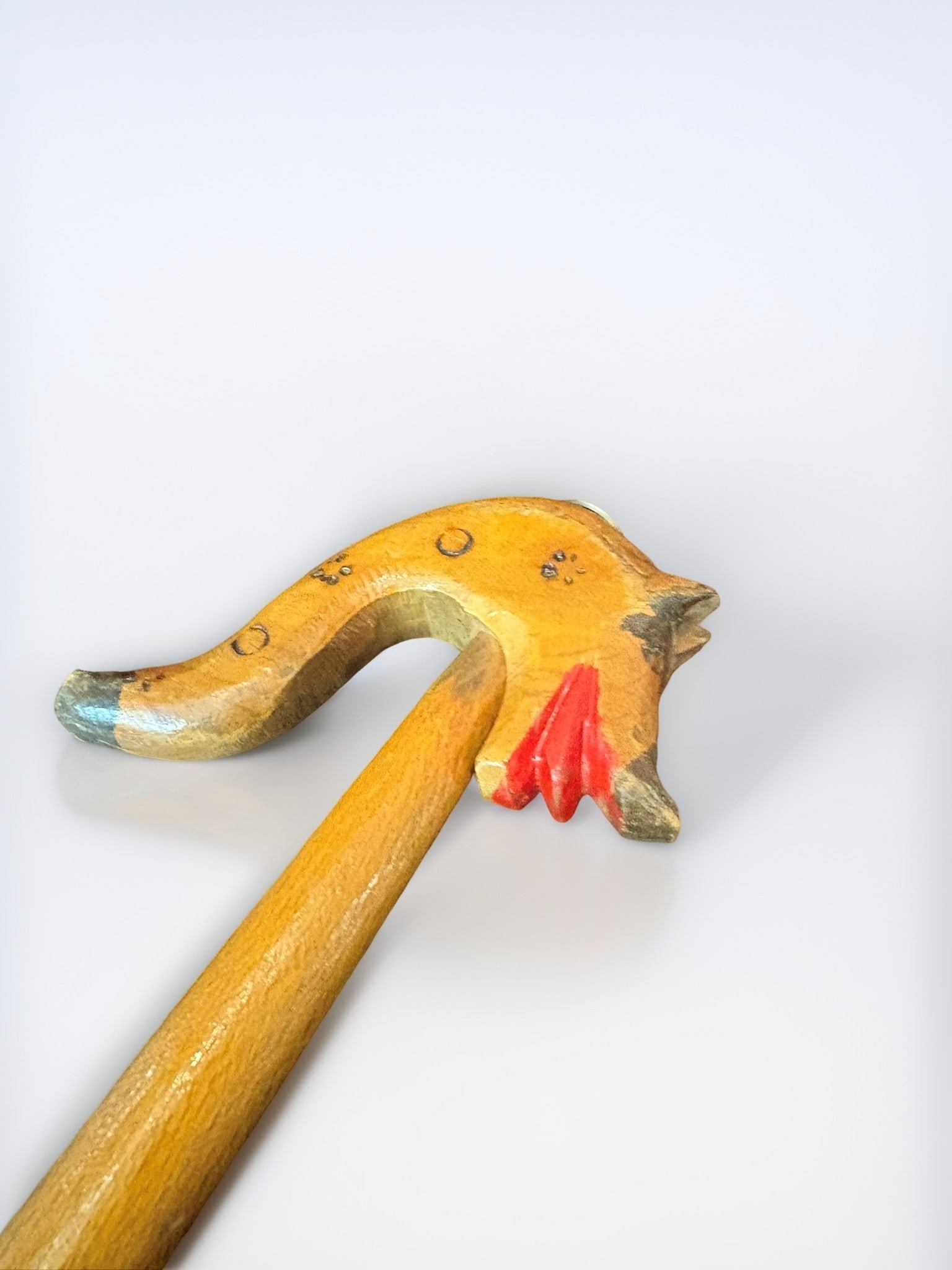 Folk Art Hand-Carved Fox Head Walking Stick: This charming folk art walking stick features a meticulously hand-carved wooden handle in the likeness of a fox. The fox head is finished with hand-painted details, including expressive features and