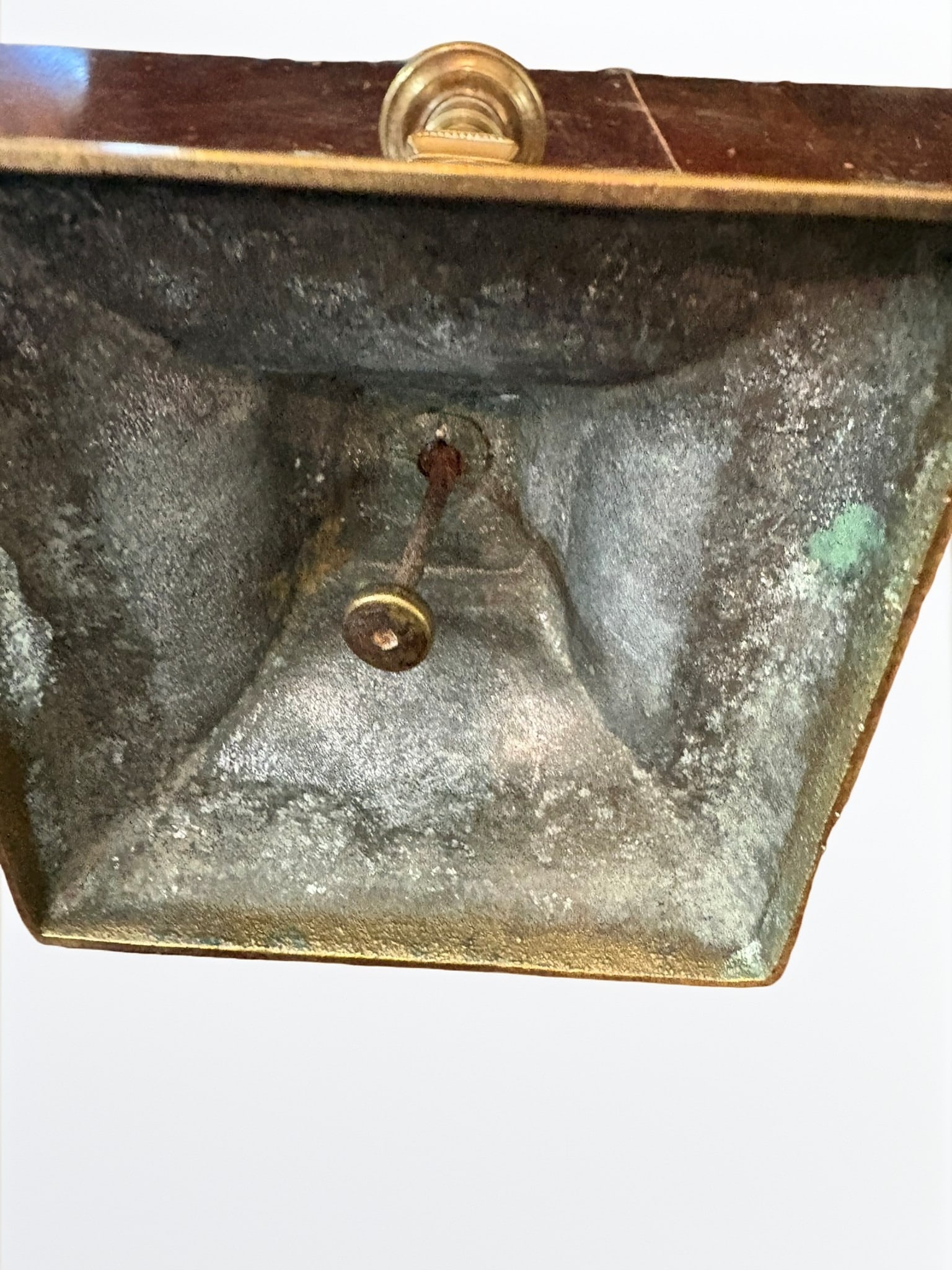 19th Century English Brass Candlestick with Ejector: A fine antique brass candlestick, likely 19th century, featuring a classic tapered shaft rising from a stepped square base. The piece retains its original spring-loaded candle ejector mechanism
