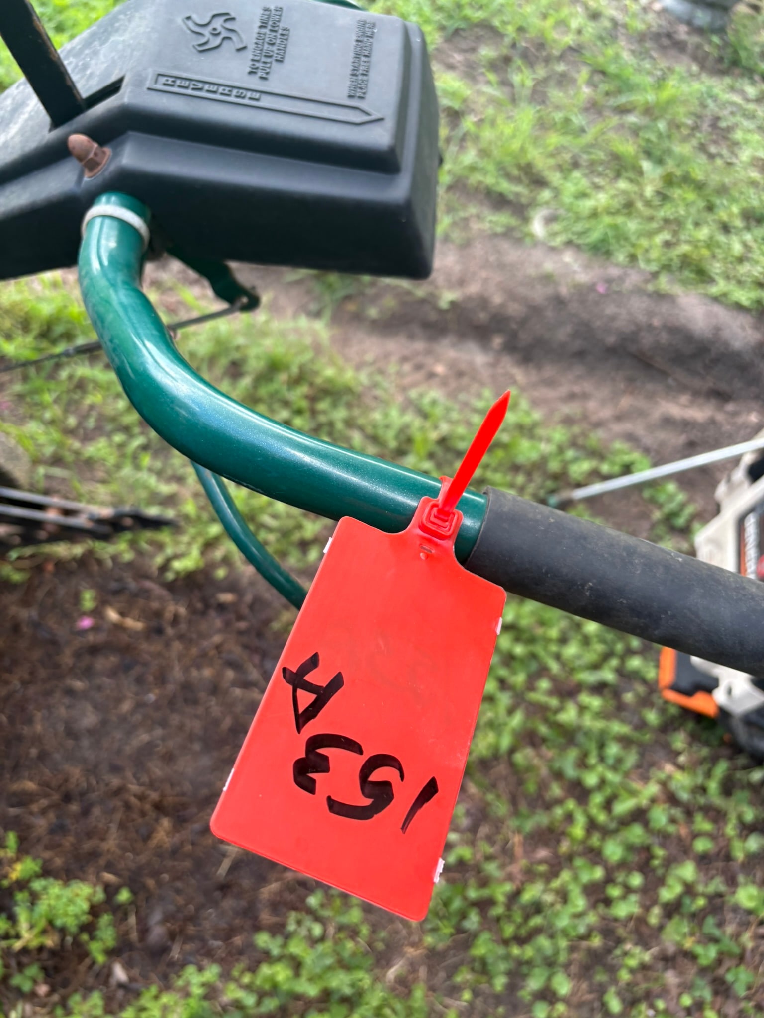 Yard-Man MTD Rear-Tine Tiller: This Yard-Man rear-tine tiller, manufactured by MTD, is a robust piece of gardening equipment designed for breaking up tough soil in residential garden beds. Featuring a reliable combustion engine