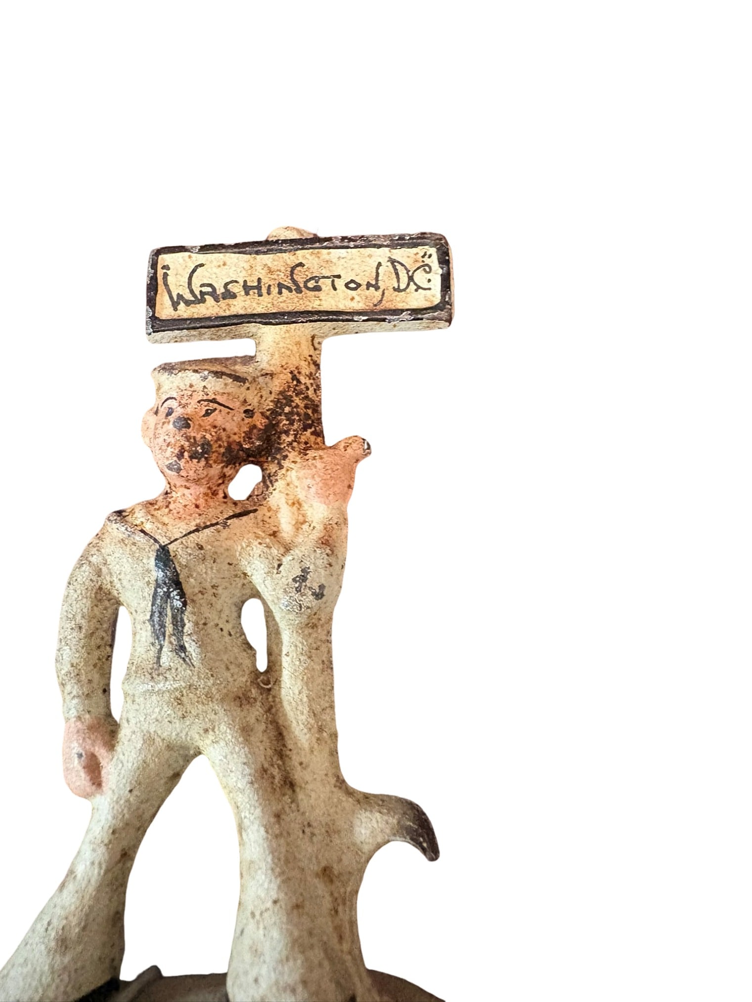 Vintage Painted Cast Iron Sailor Souvenir Figurine: This charming vintage cast iron souvenir figurine features a sailor standing next to a signpost reading 'Washington, D.C.' The piece is finished with painted details, highlighting the sailor's