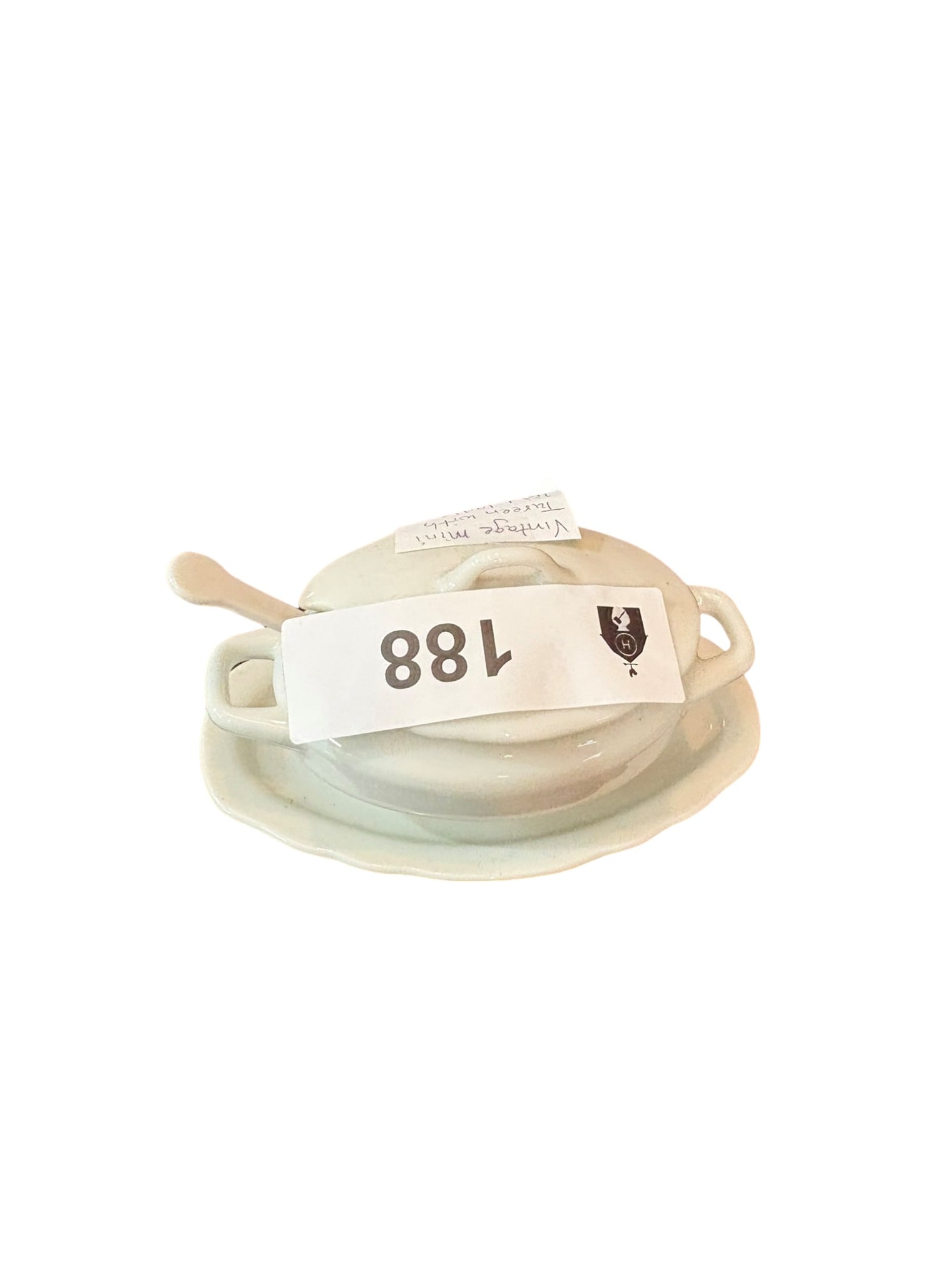 Vintage Miniature White Porcelain Tureen with Lid and Ladle: This charming vintage miniature tureen is crafted from high-quality white porcelain and features a classic oval silhouette. The set includes a matching lid and a delicate miniature ladle, resting secu