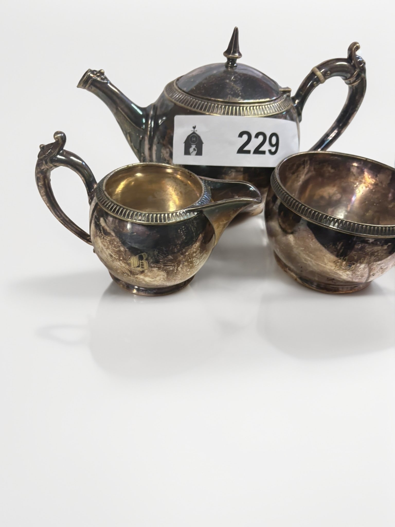 Gorham Manufacturing Company Silver Soldered Tea Service: This elegant three-piece tea service by the Gorham Manufacturing Company showcases the company's renowned craftsmanship in silver-soldered hotel ware. The set includes a teapot, creamer, and sugar bow