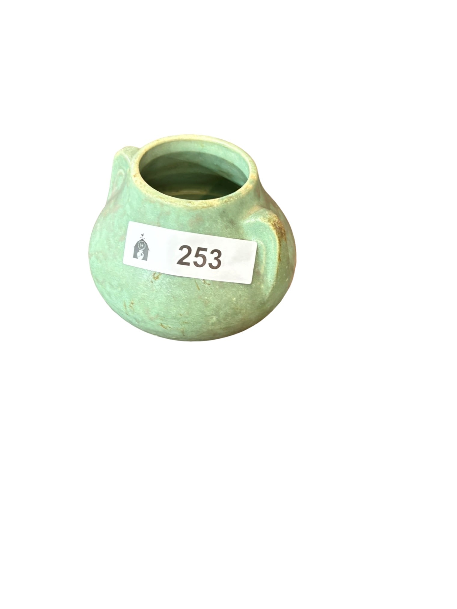 Vintage Matte Green Glazed Pottery Vase: This charming vintage pottery vase features a rounded, bulbous form with integrated side handles, finished in a distinctive soft matte green glaze with subtle mottling. The piece evokes the aesthetic 