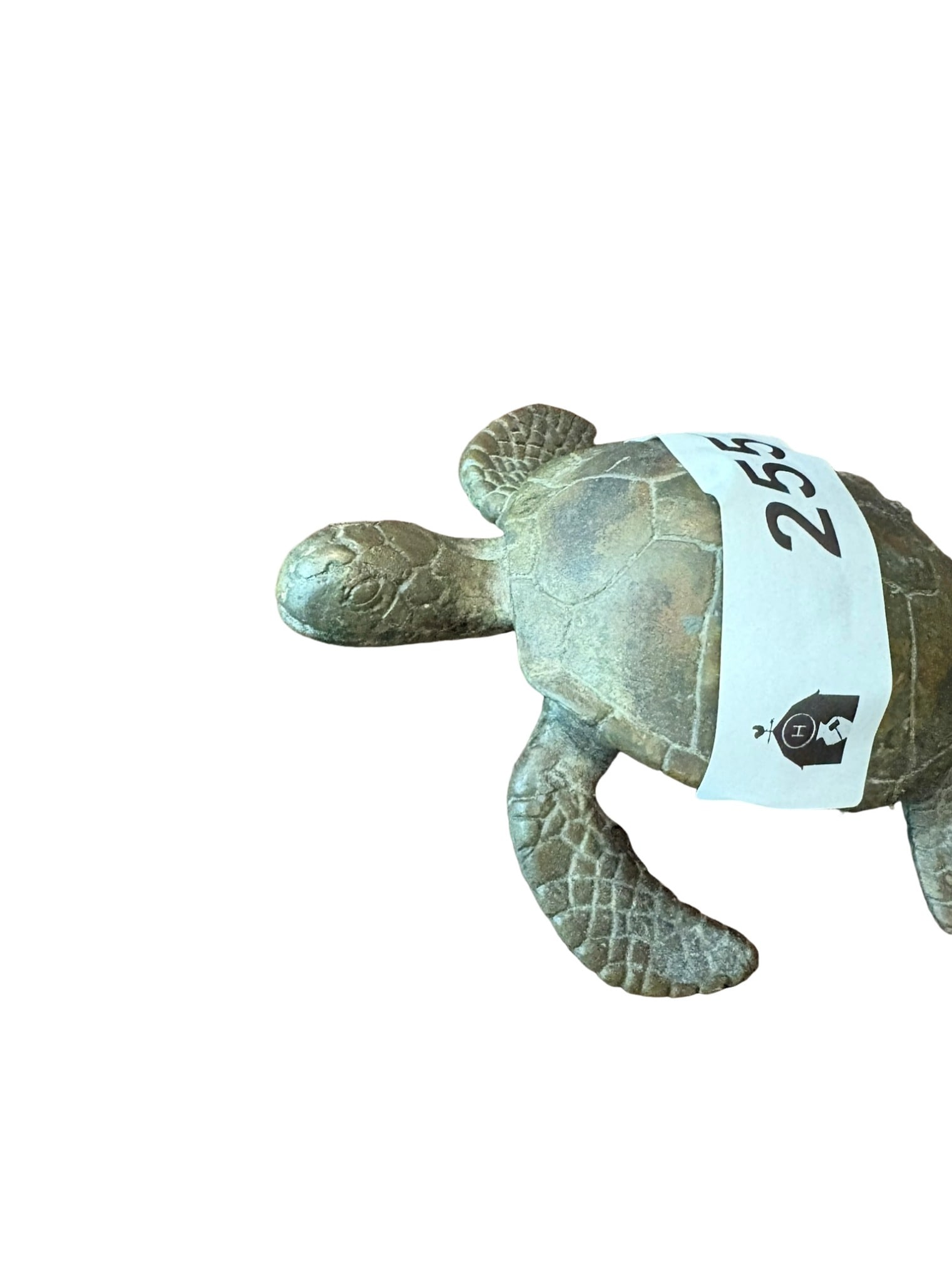 Cast Bronze Sea Turtle Sculpture: This decorative cast bronze sculpture depicts a sea turtle in a graceful swimming position. It features detailed texturing on the shell and flippers, finished with a warm, weathered patina. The piece 