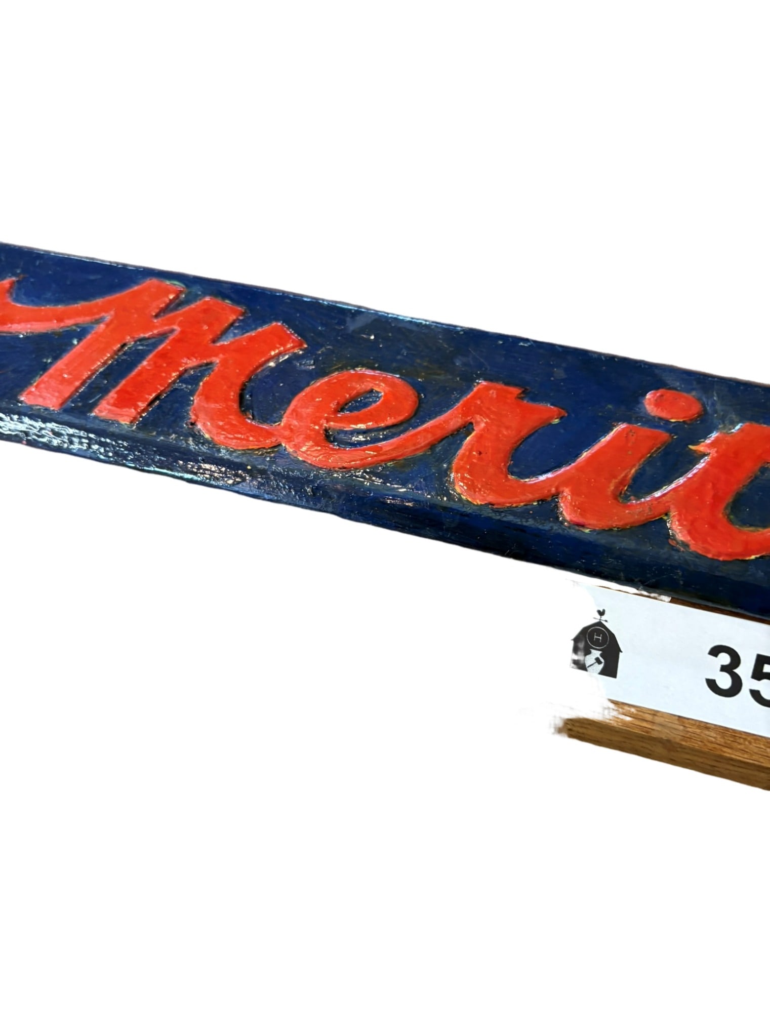 Vintage Merita Bread Metal Advertising Sign on Wood Mount: This vintage metal advertising sign features the iconic Merita Bread branding in bright red lettering on a contrasting blue background. The metal sign is securely mounted to a wooden backing board, li