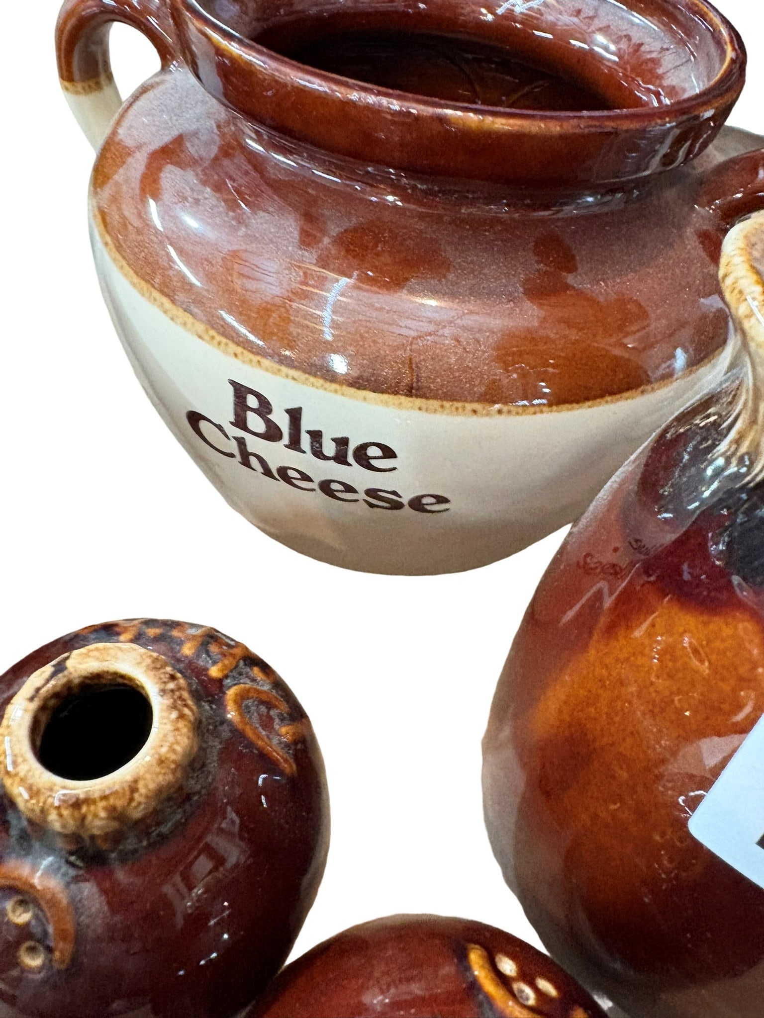 Collection of Vintage Two-Tone Glazed Stoneware Kitchenware: This charming collection consists of five vintage stoneware kitchen items, featuring the classic two-tone brown and beige glaze characteristic of early to mid-20th-century pottery. The set includes a 