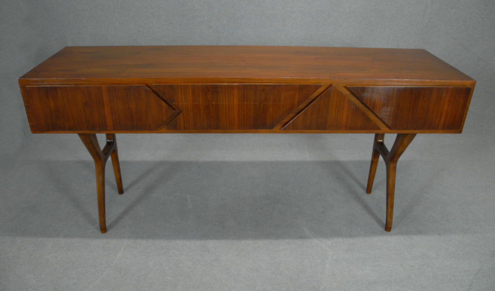 MELCHIORRE BEGA (Attr.). Walnut console (1 of 5)