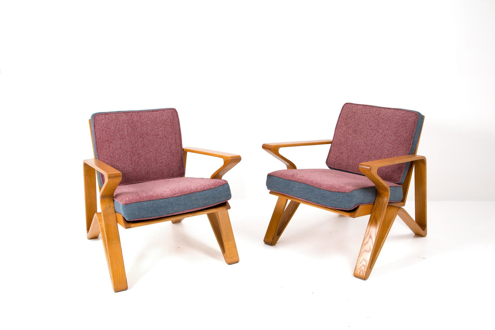 Pair of italian wooden and fabric armchairs.: Coppia di poltrone in legno e tessuto. Manifattura italiana. Anni '50. Mis. Lung. cm. 74 Alt. cm. 80 Prof. cm. 80 ca.