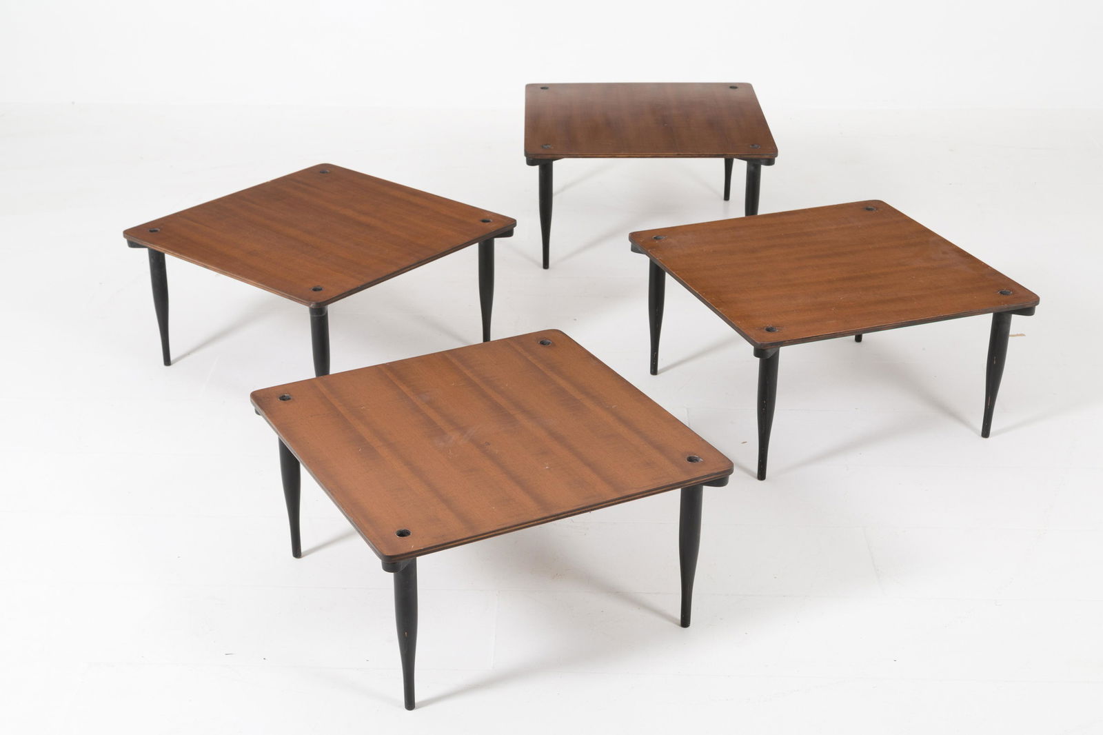 VICO MAGISTRETTI for AZUCENA. Four coffee tables: VICO MAGISTRETTI (Milano, 1920-2006) per AZUCENA. Quattro tavolini di servizio in legno sovrapponibili. Anni '50-'60. Pubblicati in R. Aloi, Esempi di Arredamento Moderno di Tutto il Mondo: Tavoli, Ta
