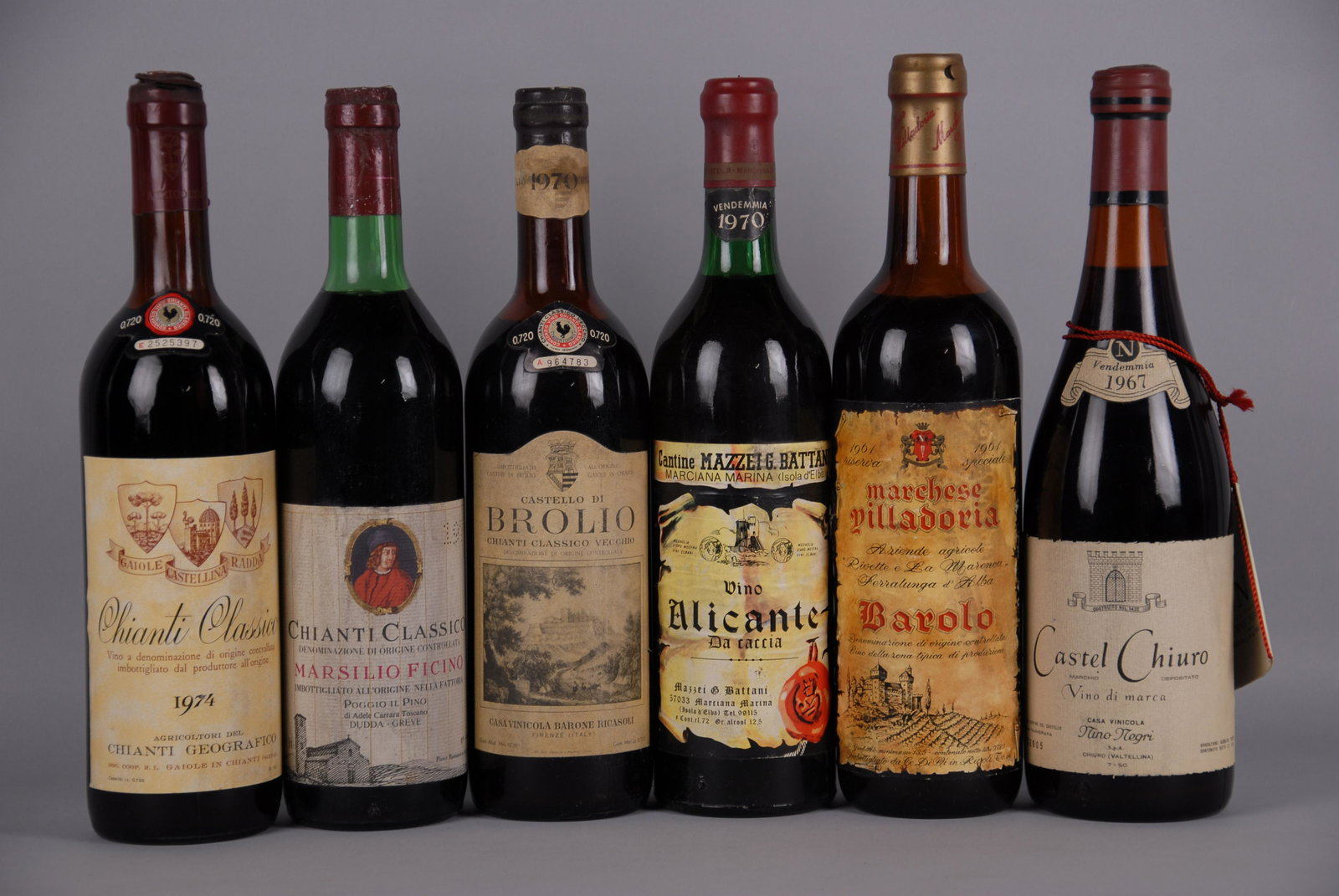Six bottles of various red wine: Sei bottiglie di vino di cui una di Castel Chiuro casa vinicola Nino Negri 1967, una di Barolo Marchese Villadoria 1961, una di Alicante Mazzei Battani 1970, una di Chianti Brolio 1970, una di Chianti