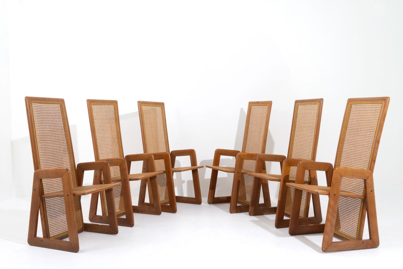 FABIO LENCI (Attr). Six straw and wooden chairs: FABIO LENCI (Attr.) (Roma, 1935). Sei sedie in legno e paglia di Vienna con schienale alto. 1970 ca. Difetti. Mis. Lung. cm. 52 Alt. cm. 155 Prof. cm. 60 ca. Val. 4000/6000