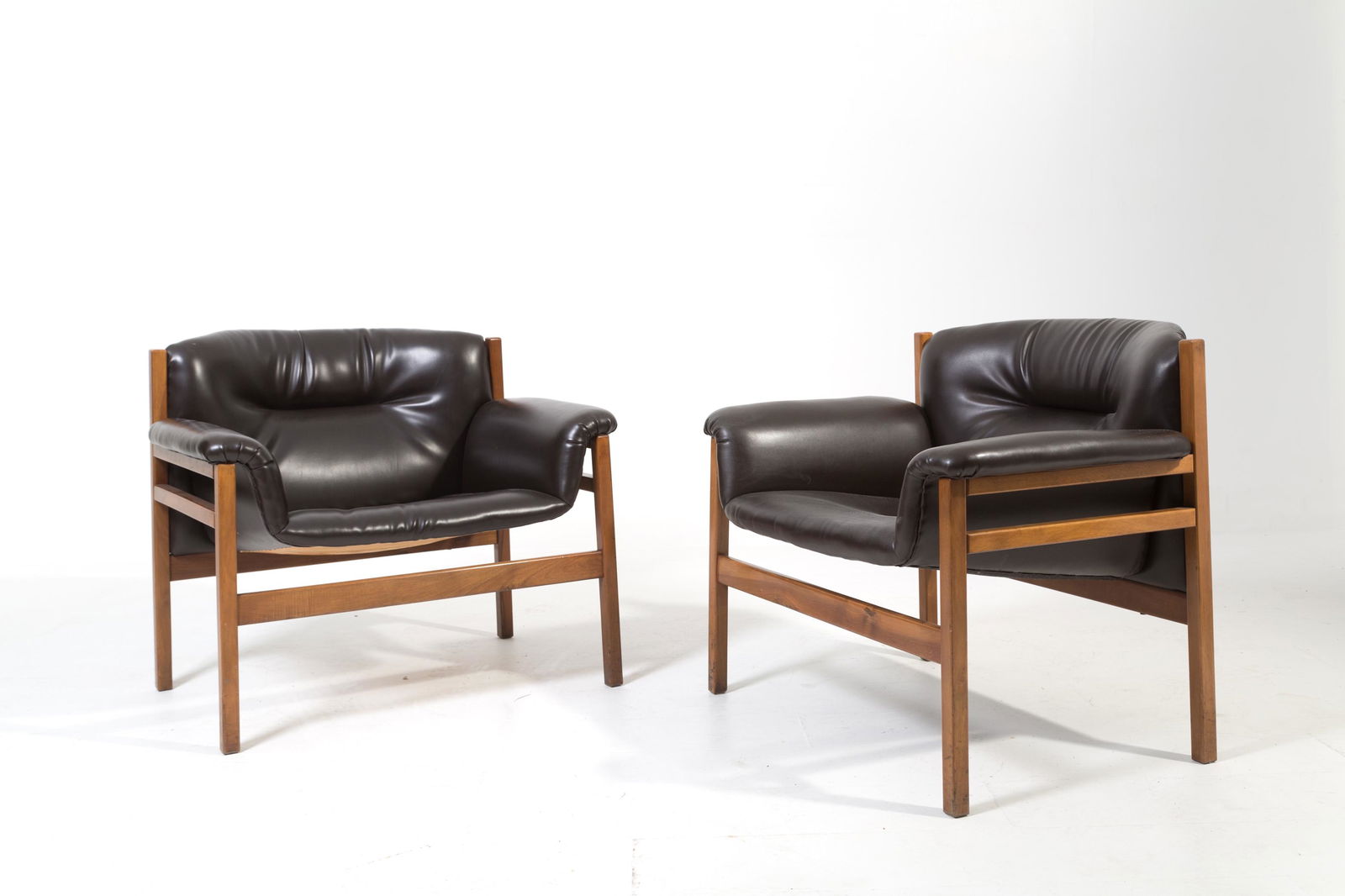 TITO AGNOLI. Two black wooden armchairs. 1960s (1 of 5)