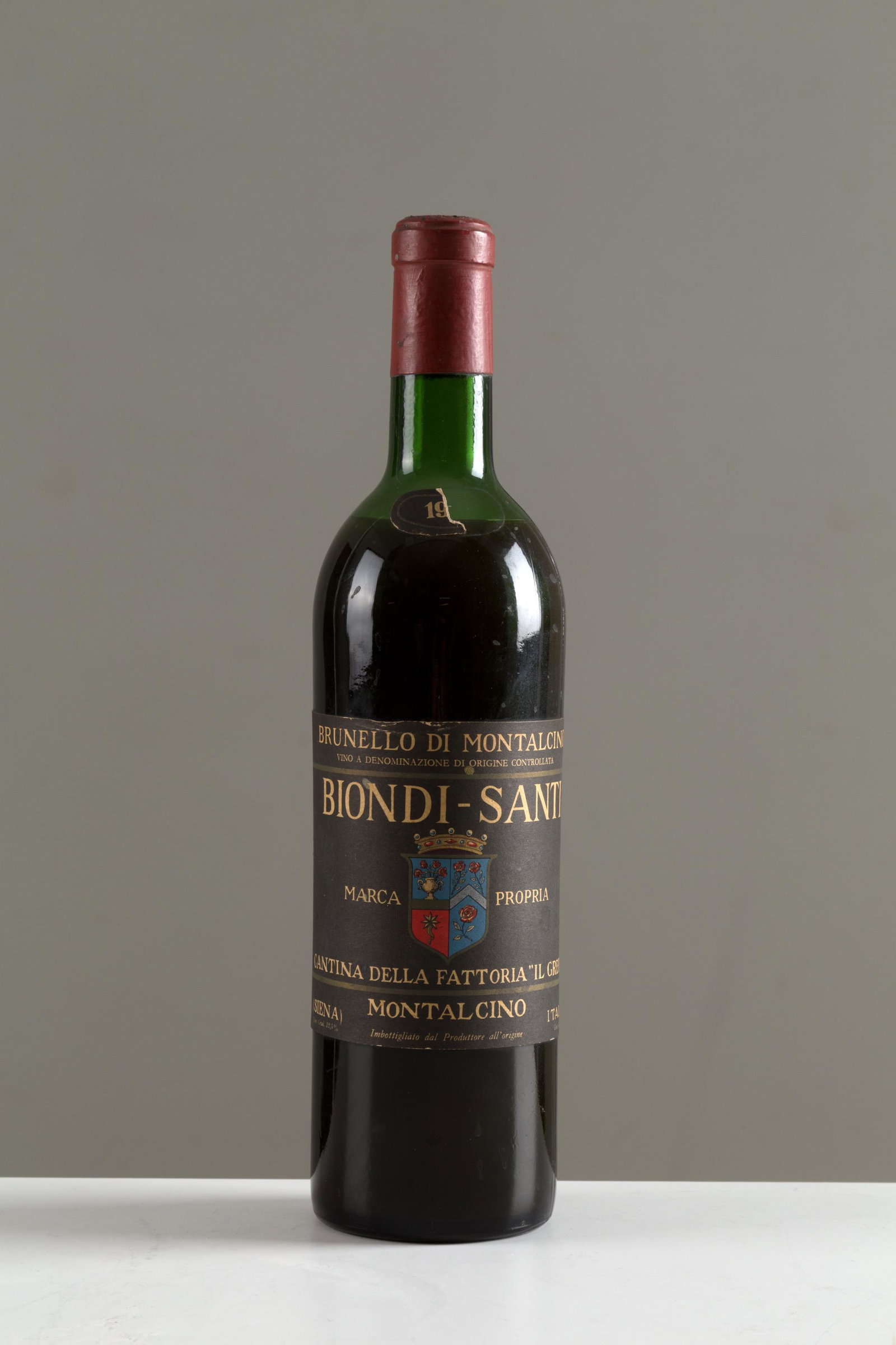 Brunello di Montalcino Greppo Biondi-Santi (1 bt): Brunello di Montalcino Biondi-Santi tenuta Il Greppo (1 bt). Con frammento di etichetta recante l'anno. Val. 80/100