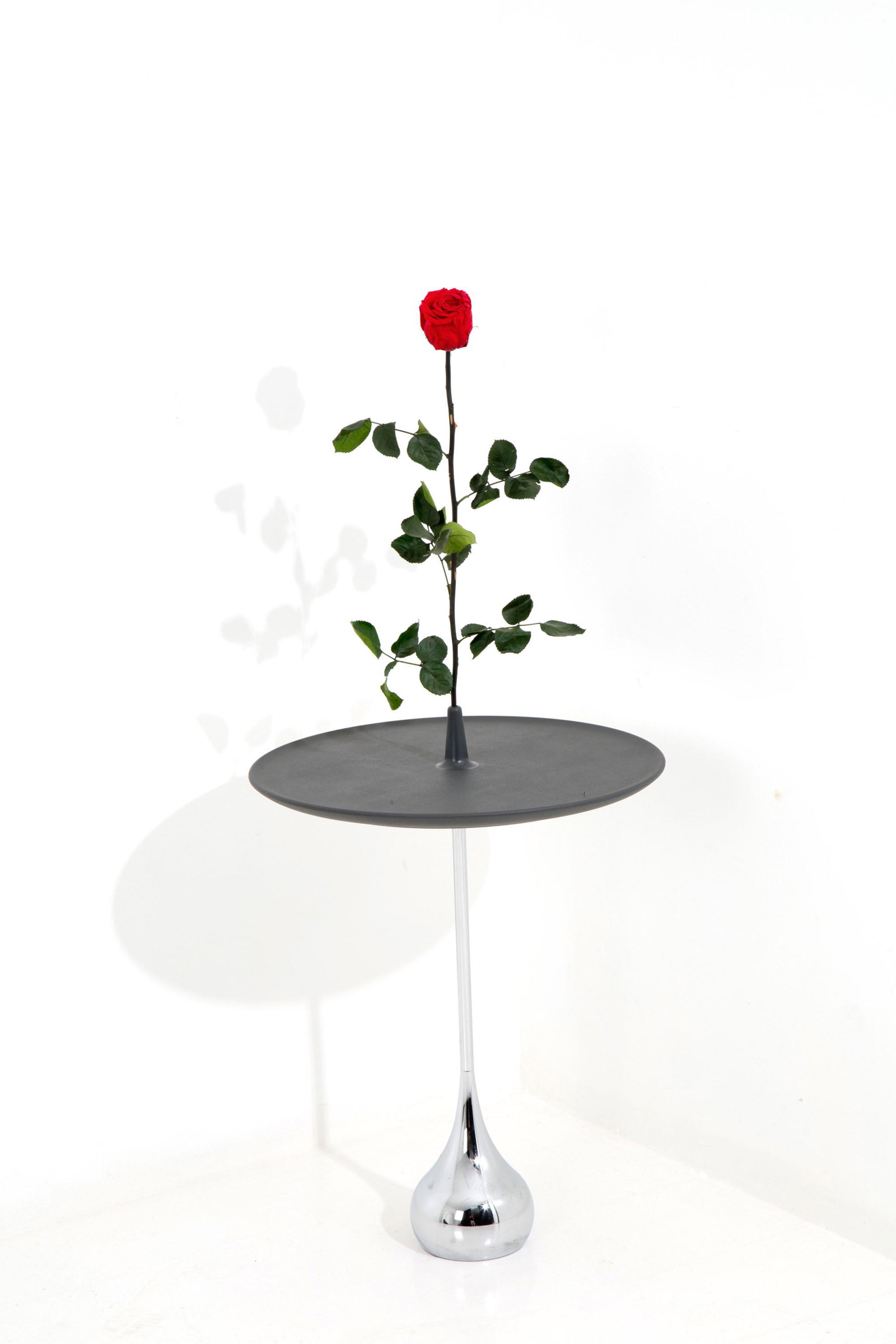 DENIS SANTACHIARA. Celine coffee table for BALERI ITALIA: DENIS SANTACHIARA (Campagnola, 1950). Celine service table with chromed steel base and pink up stem in the center of the removable polyurethane top-tray. BALERI ITALIA production. 1997. Height 58-74,