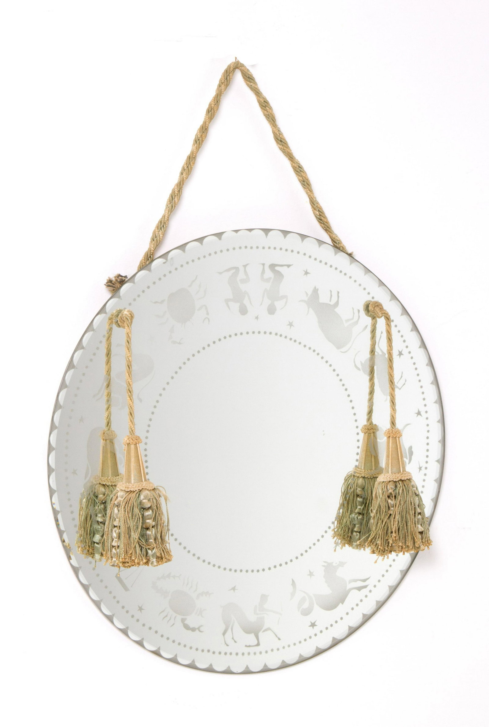 Mirror with zodiac signs: Beveled glass mirror with zodiac signs on the broth. 50s. Diameter 50cm approx. Specchio in vetro molato con segni zodiacali sul brodo. Anni '50. Diam. 50 cm ca.