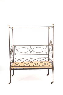 Wrought iron canopy bed: Wrought iron canopy bed on casters, painted in pure gold, with four gilded bronze knobs and a reclining side. Tuscany. Early 19th century. Defects and missing parts. 184x135x74 cm approx. Lettino a ba