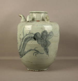 Ceramic vase with pourer: A blue and white glazed ceramic vase with spout. Cambodia. Restoration. Height approx. 33 cm. Vaso con versatoio in ceramica smaltata bianca e blu. Cambogia. Restauri. Alt. 33 cm ca.