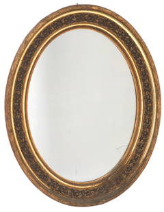Oval mirror: Oval mirror in carved and gilded wood. 19th century. Minor losses. 64x52 cm approx. Specchiera ovale in legno intagliato e dorato. XIX secolo. Lievi mancanze. 64x52 cm ca.