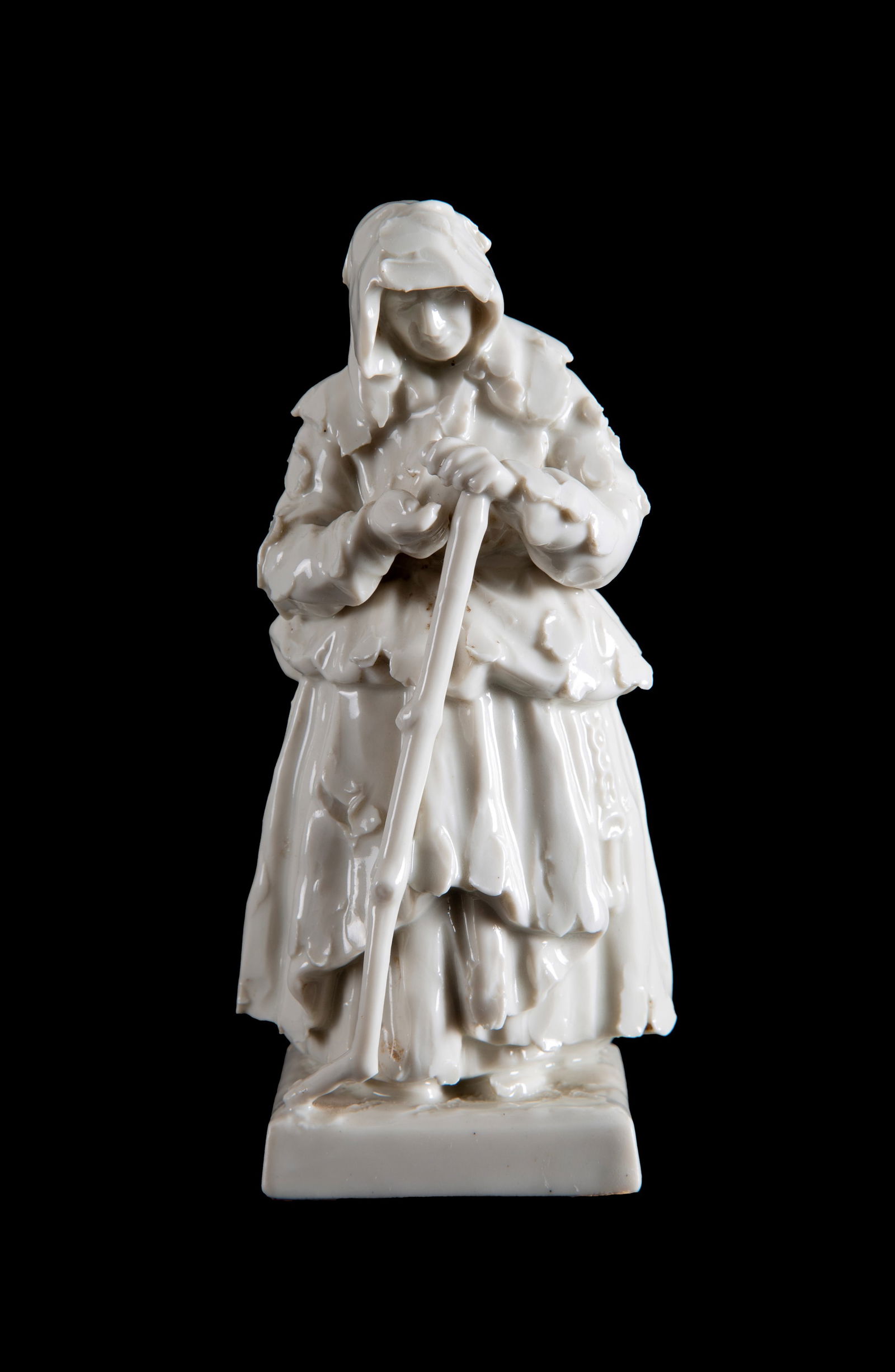 Sculpture "BEGGAR". CAPODIMONTE: White porcelain sculpture depicting "BEGGAR". CAPODIMONTE manufacture. Marked on the bottom. 20th century. 15x7.5x7.5 cm approx. Scultura in porcellana bianca raffigurante ?MENDICANTE?. Manifattura CA