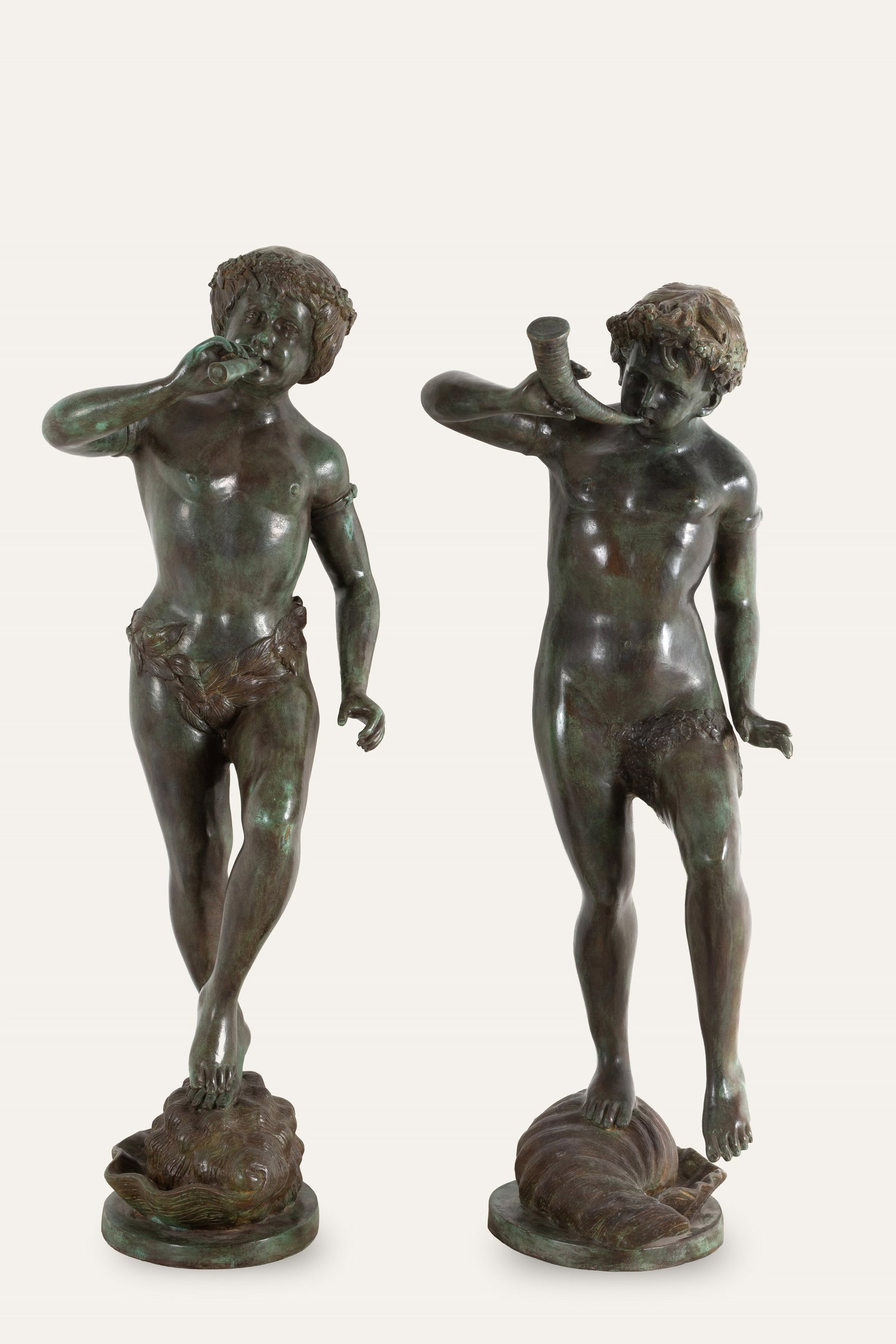 Coppia di sculture "FAUNI": Pair of patinated bronze sculptures depicting "FAUNS". 20th century. Height approx. 125 cm. Coppia di sculture in bronzo patinato raffiguranti "FAUNI". XX secolo. Alt. 125 cm ca.