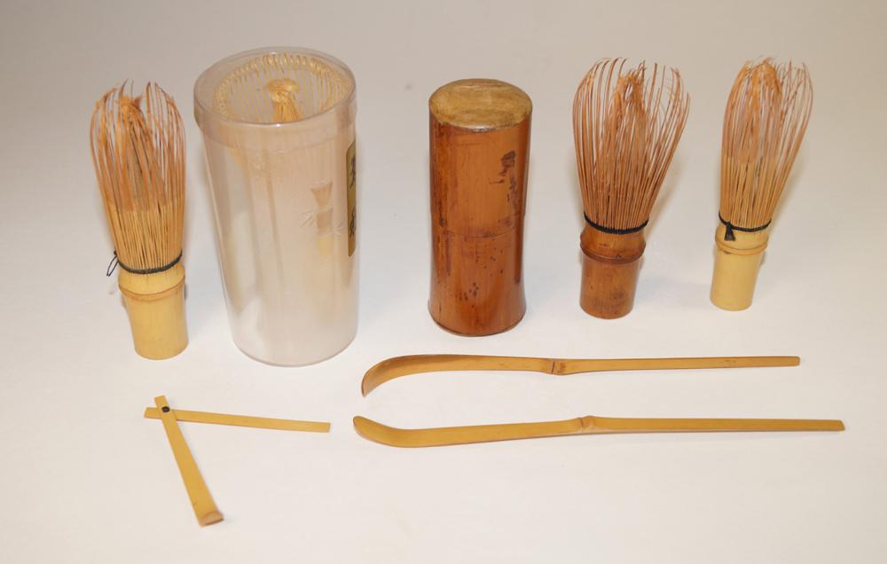 Japanese Antiques Convolute, tea utensils: Japanese Antiques Convolute, tea utensils Five bamboo tea brooms in an original bamboo box and four bamboo spoons, one of them foldable. (265)