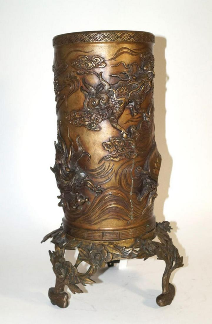 Japanese Antiques High bronze vase on pedestal / late: Japanese Antiques High bronze vase on pedestal / late Meiji period Two-piece cylindrical heavy thick-walled vase (h. 39 cm) on base (h. 16 cm), bronze golden brown patina. Decorated in high relief wit