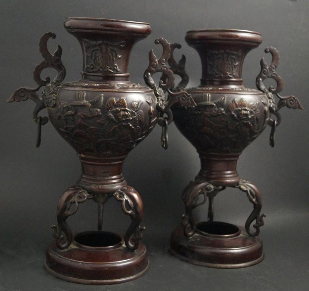 Japanese Antiques High pair of handle vases: Japanese Antiques High pair of handle vases Bronze vases with reddish brown patina, h. 29 cm, d. 13 cm. Wall decorated with flowers and birds in relief. Lightly dam. (208)
