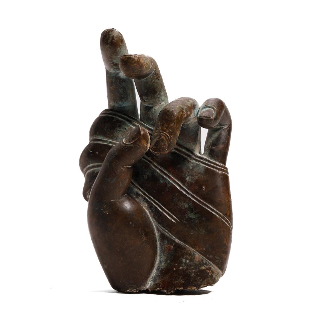 A BRONZE BUDDHA HAND (1 of 6)
