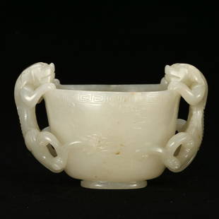 A WHITE JADE CUP WITH BEAST-FORMED HANDLES: L:11.7cm