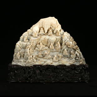 A WHITE JADE 'FIGURES' BOULDER WITH STAND: L:27cmH:17cm