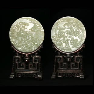 A PAIR OF CIRCULAR WHITE JADE 'FIGURES' TABLESCREENS: H: 37.2cmD:21.5cm