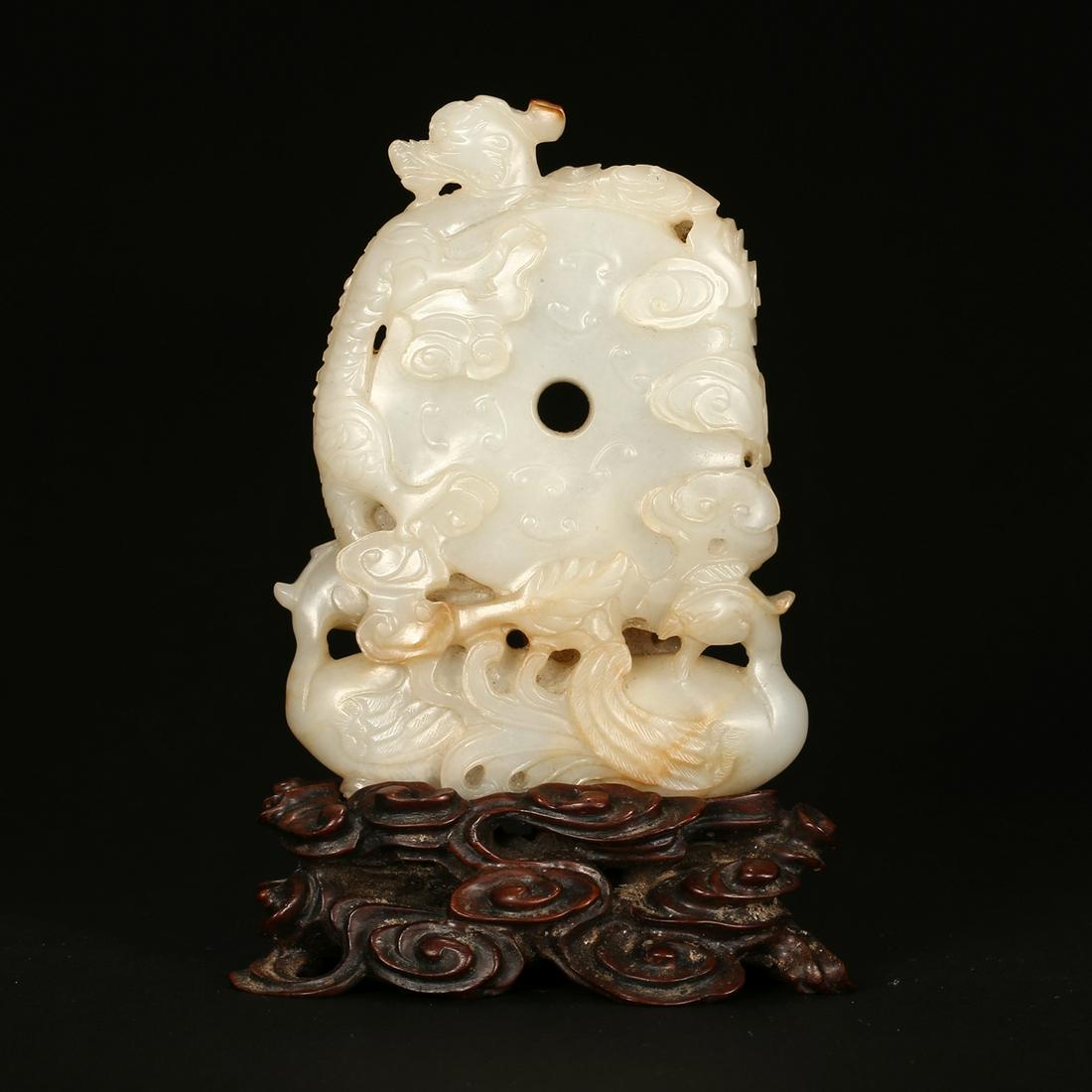 A WHITE JADE 'DRAGON AND PHOENIX' DISC ON STAND (1 of 7)