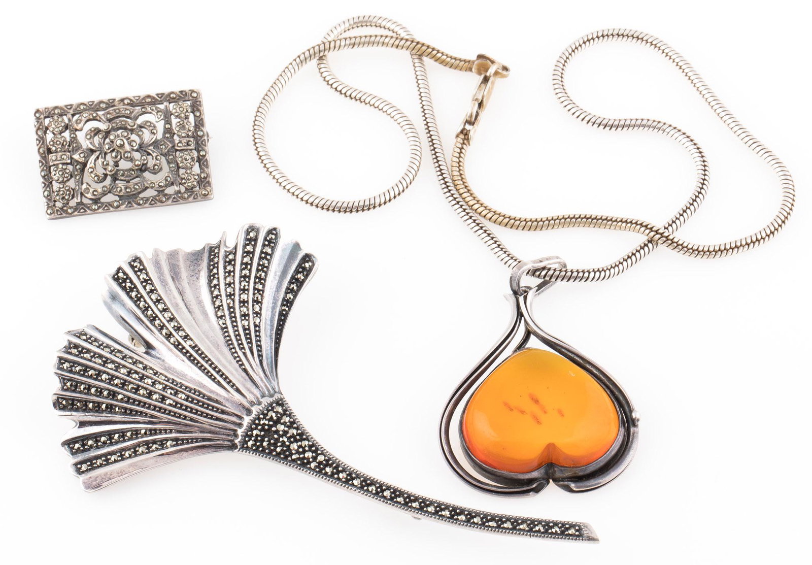 STERLING SILVER AMBER NECKLACE EARRINGS & BROOCHES: STERLING SILVER AMBER NECKLACE EARRINGS & BROOCHES Sterling silver jewelry to include: One ginko leaf brooch studded with marcasite, 4" One open work rectangle brooch studded with marcasite, 33 x 23