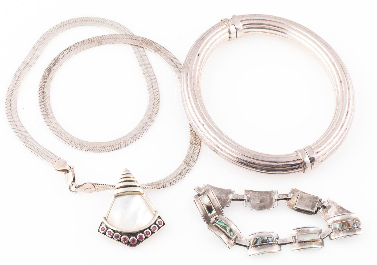 STERLING SILVER NECKLACES AND TWO BRACELETS: STERLING SILVER NECKLACES AND TWO BRACELETS Sterling silver jewelry including: One necklace with mother of pearl and ruby stones Two bracelets, one with abalone shells Weight: 61.9 grams