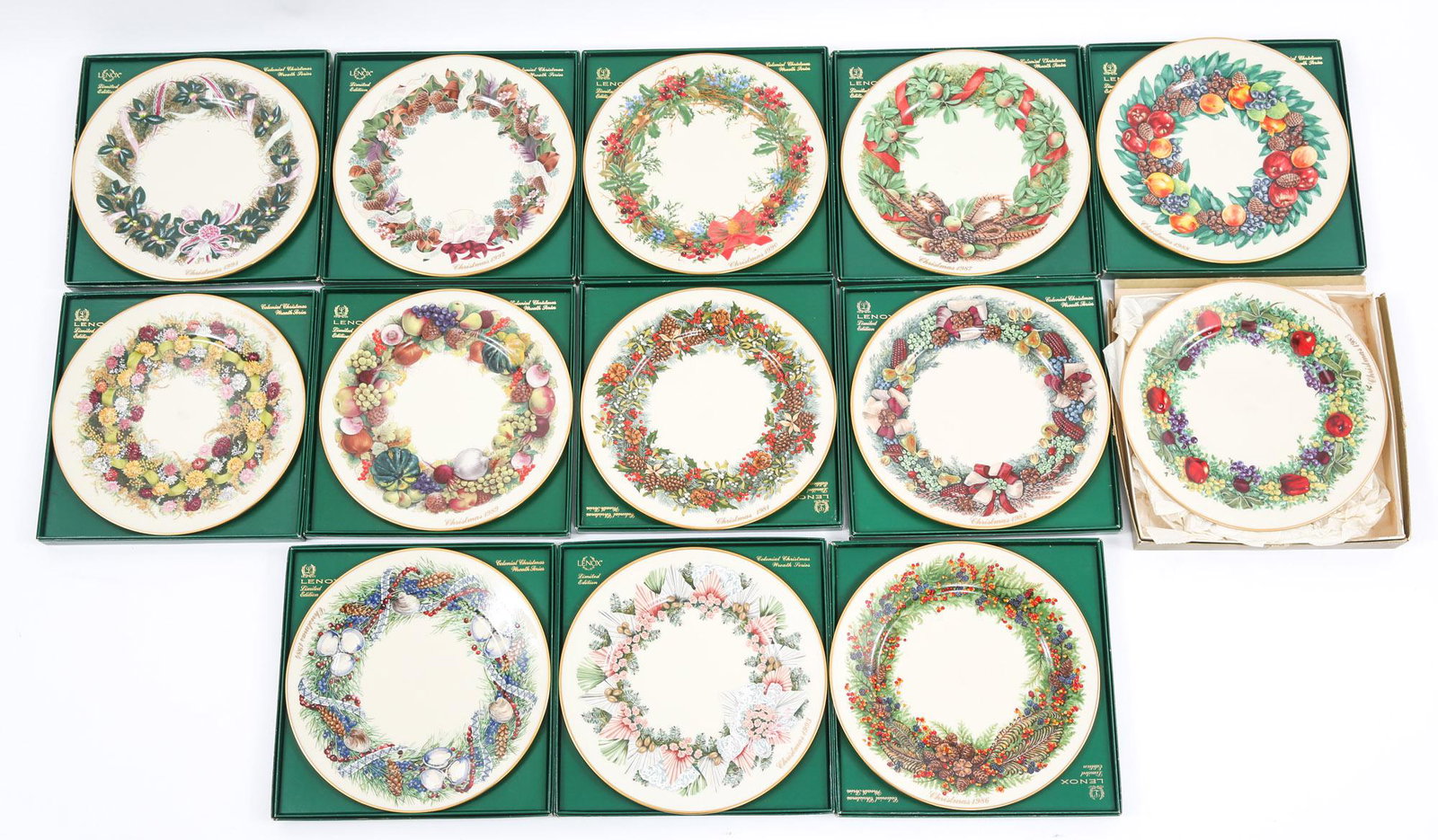 LENOX PORCELAIN COLONIAL CHRISTMAS COLLECTORS PLATES: LENOX PORCELAIN COLONIAL CHRISTMAS COLLECTORS PLATES Thirteen Lenox porcelain Colonial Christmas collectors plates with boxes, to include 1982-1988, (2) 1989, 1990-1993. Size: 8"