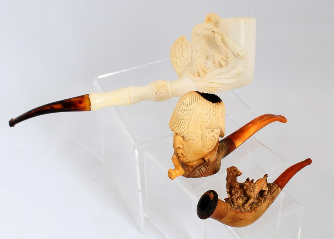 MEERSCHAUM TOBACCO PIPES WITH CASES LOT OF THREE: MEERSCHAUM TOBACCO PIPES WITH CASES LOT OF THREE Three meerschaum tobacco pipes: Figural dog grouping Sherlock Holmes inspired Contemporary eagle and snake grouping Size: 5 1/4" to 10 1/2"