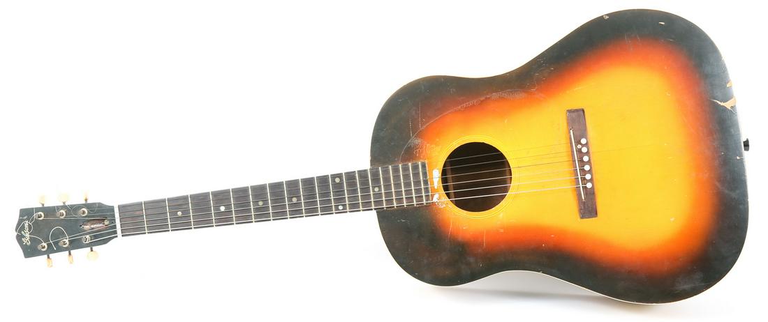 1935 GIBSON JUMBO FLAT TOP GUITAR: 1935 GIBSON JUMBO FLAT TOP GUITAR 1935 Gibson Jumbo Flat Top guitar. In original case. Factory order number 1206. Condition: Pickguard missing; nut has been replaced; cracking to body; loss to finish 