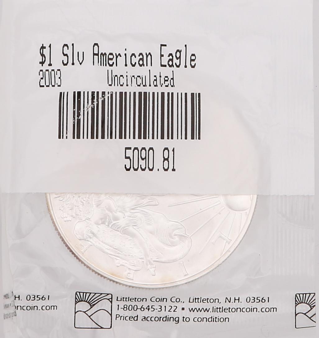 2000 & 2003 UNITED STATES SILVER EAGLE 1 OZ COINS: 2000 & 2003 UNITED STATES SILVER EAGLE 1 OZ COINS Lot of 2 United States Silver Eagle bullion coins, minted in the years 2000 and 2003. Struck in one ounce fine silver and set in Littleton Coin Co. pa