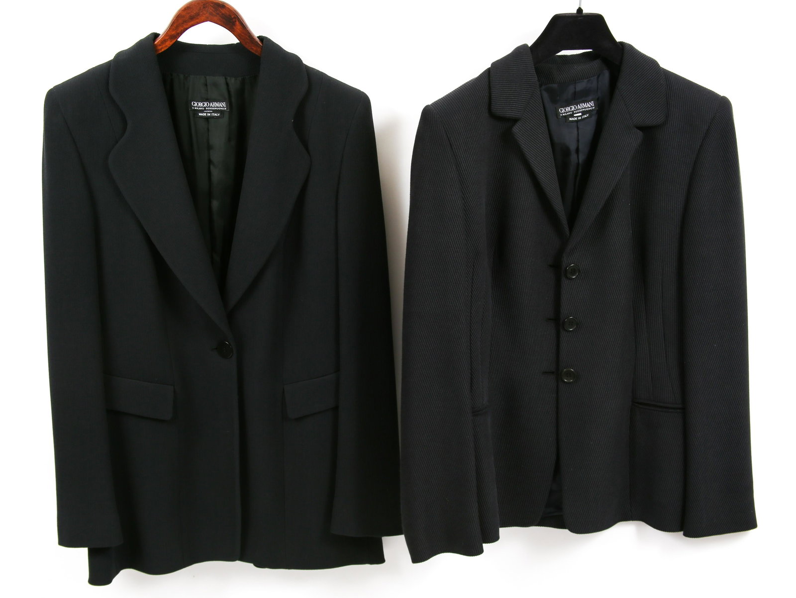 WOMEN'S GIORGIO ARMANI BLAZERS - LOT OF 2: WOMEN'S GIORGIO ARMANI BLAZERS - LOT OF 2 Giorgio Armani silk (50%), rayon (35%), pure new wool (15%) three-button blazer with rayon lining and French darts on either side of front, black; pockets are