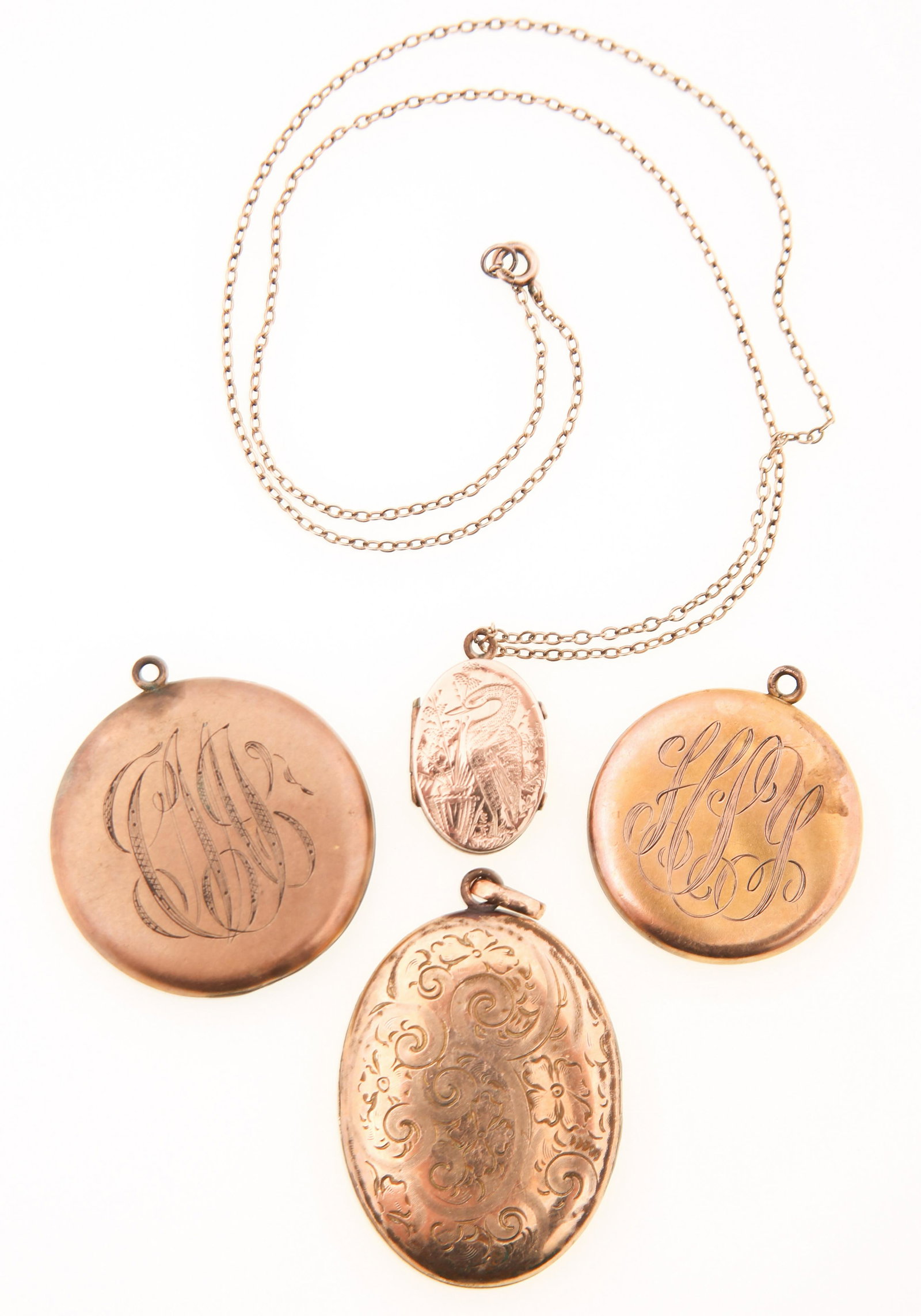 WOMEN'S GOLD FILLED LOCKETS - LOT OF 4: WOMEN'S GOLD FILLED LOCKETS - LOT OF 4 Four gold filled lockets, includes: Two monogrammed One floral pattern One bird pattern with chain Weight: 40.6g